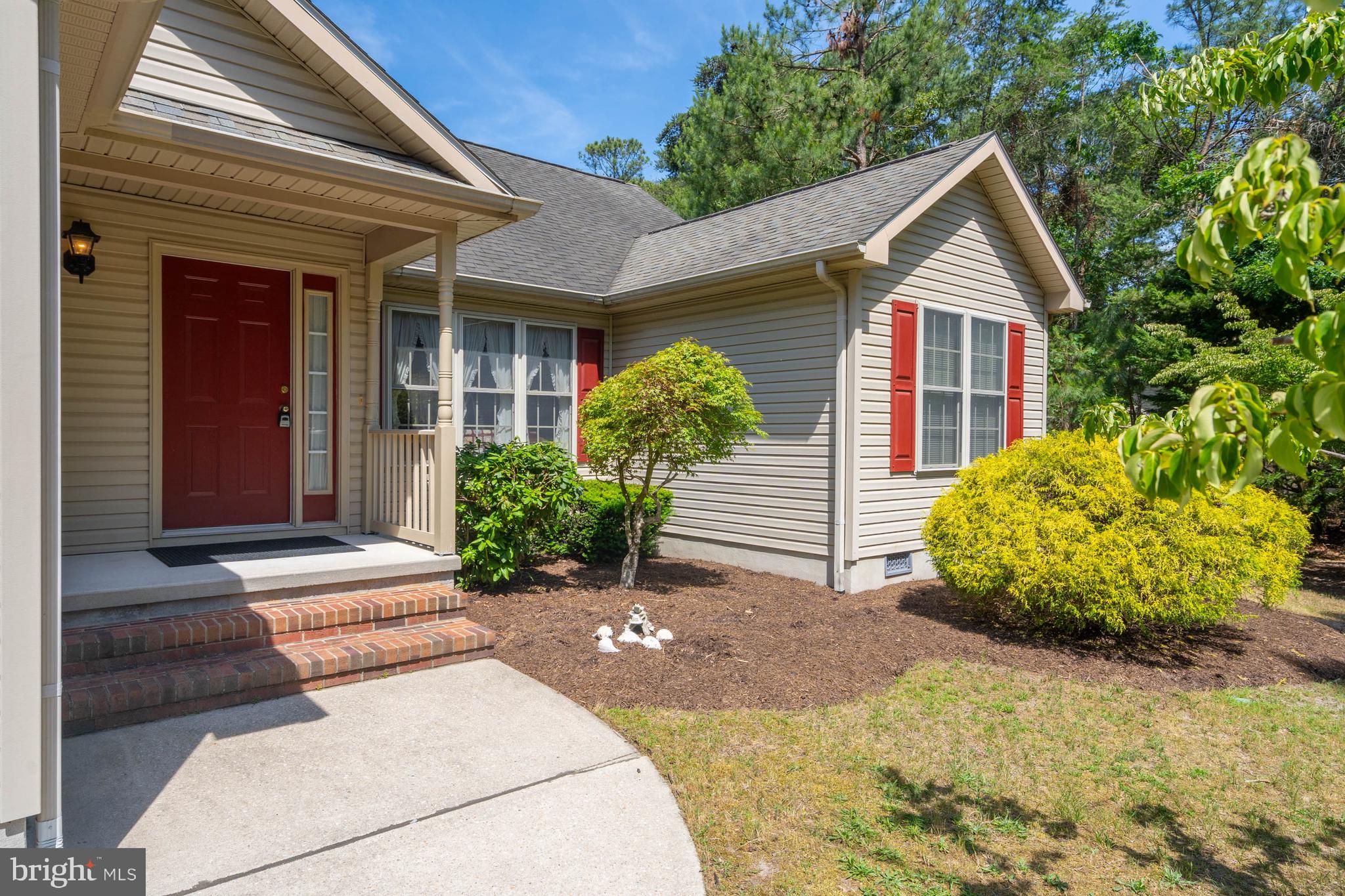 Welcome home to the established community of Woods on Herring Creek.  This 1st floor style living welcomes you into the home with an oversized living area with gas fireplace.  The kitchen and eat-in areas offer room for holiday meals and relaxation.  An additional sunroom off the eat-in area opens to the rear yard with deck and patio surrounded by nature.  The mature landscape allows room for you the new homeowner to make it your own.  Offering 3 bedrooms, 2 full baths, and a 2 car garage the owners suite is separated from the additional 2 guest bedrooms. There is a full staircase to the attic and many community amenities include pickleball courts, basketball courts, pool, tennis courts, and tot lot.  Located close to all your wants and priced to sell this home is calling you.