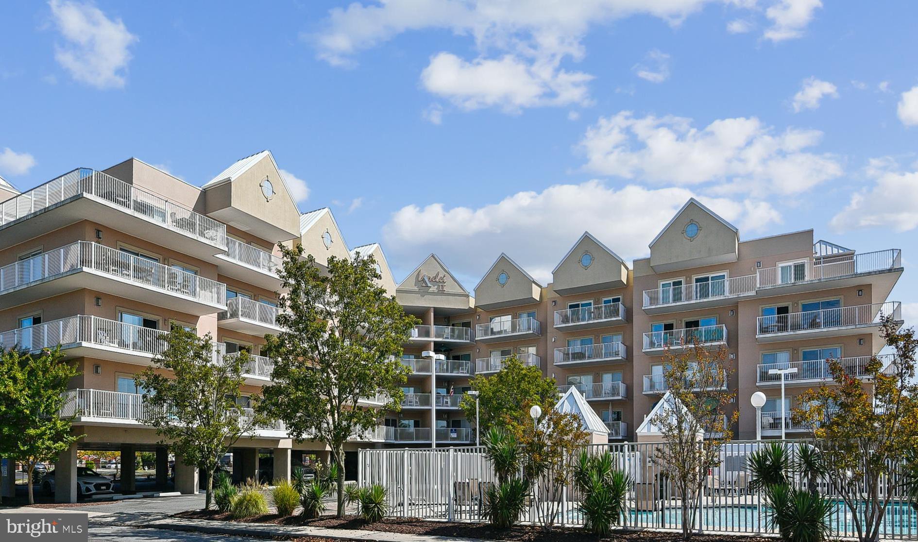 Welcome to this beautifully maintained 2-bedroom, 2-bath condo perfectly positioned bayside in Ocean City, overlooking the iconic Northside Park. This 58-acre recreational complex features playgrounds, outdoor fitness areas, grills, sports fields, a 1-mile paved walking path, water access with a lagoon pier, and a fishing & crabbing pier that stretches nearly 1,000 feet into the Assawoman Bay. Kayak and paddleboard rentals make waterfront adventures just steps from your door!

Inside, the fully furnished condo offers an open-concept floorplan with a cozy electric fireplace and a private balcony with sweeping park views. The building includes a private inground pool for residents and each unit comes with its own dedicated storage unit—perfect for beach gear.

The location is unbeatable—just a few minutes’ walk to the beach, Grotto’s Pizza, Starbucks, mini golf, and Dumser’s Dairyland. Whether you’re looking for a vacation retreat, investment property, or year-round home, this unit checks all the boxes. With a strong rental history through spring and summer, it’s an excellent opportunity to enjoy Ocean City while generating income.

Don’t miss your chance to own a slice of bayside paradise!