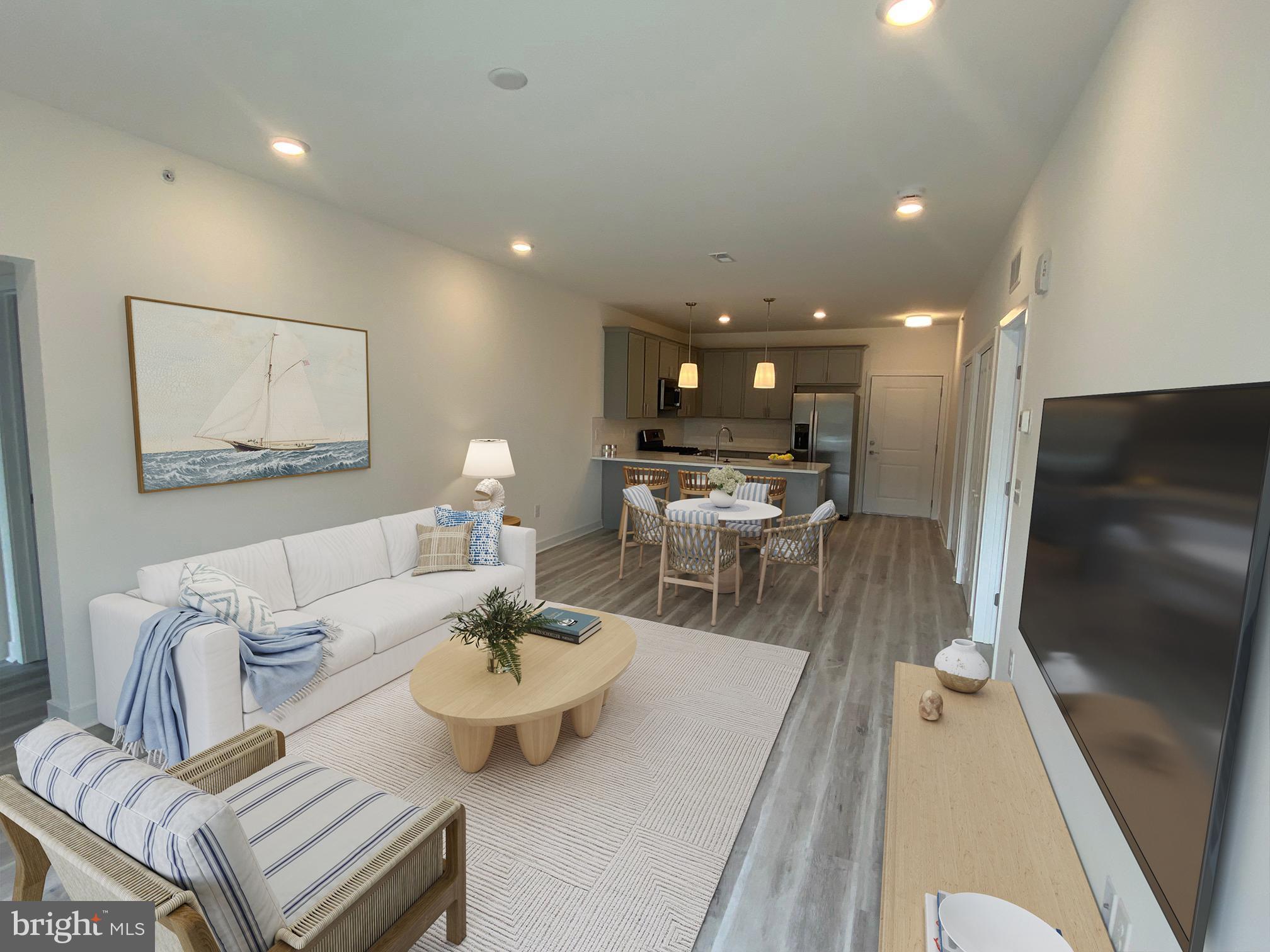 First Floor Cardinal unit .  Come explore this water oriented condominium project in Lewes, Delaware. Located off of John J. Williams Highway just 5.5 miles to Rehoboth beach and 9.6 miles to Cape Henlopen State Park. Building A complete and ready for occupancy. Project is a total of six buildings with 30 units. Community features pool and pool house and a gated entrance for security.   One level living of 1113 square feet.. Unit features nine foot ceilings, Granite countertops in kitchen and baths, stainless steel appliances, ceramic tile shower walls and natural gas.  Large private balcony and building has a common elevator. Sales center open 10-2 Saturday and Sunday.
Some photos virtually staged for design ideas.