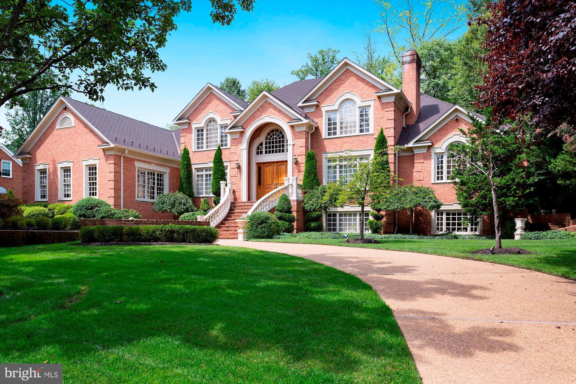 Striking brick colonial sited prominently atop a spectacular .83 acre lot in Millwood.  Approximately 9000 finished square feet of solid, quality construction that has been impeccably maintained and updated. The light-filled home along with its private rear grounds provide for elegant entertaining and easy everyday family life. There is more than enough room to add a pool to the current yard, which already features a large, pristine flagstone patio, well-conceptualized hardscaping, incredible mature landscaping and a hot tub.  The gracious main level offers a grand foyer with a sweeping staircase, formal living and dining rooms, a gorgeous two-story family room with masonry fireplace, a handsome paneled library, a gourmet eat-in kitchen with back stairs to the lower and upper levels, and lastly an exquisite main level primary bedroom with large luxury bath. The upper level features three secondary bedrooms, all with en-suites bathrooms and walk-in closets. The lower level boasts two expansive recreation rooms, one that offers a pool table, a theatre and a large bar along with a bonus storage space & a second staircase to the kitchen .  The second recreational room features a handsome fireplace and loads of natural light, and it leads to  a large bedroom and bathroom plus an additional den-the perfect space for guests.   All this and located on a private cul-de-sac in an established neighborhood conveniently location to all that McLean and Tysons have to offer.