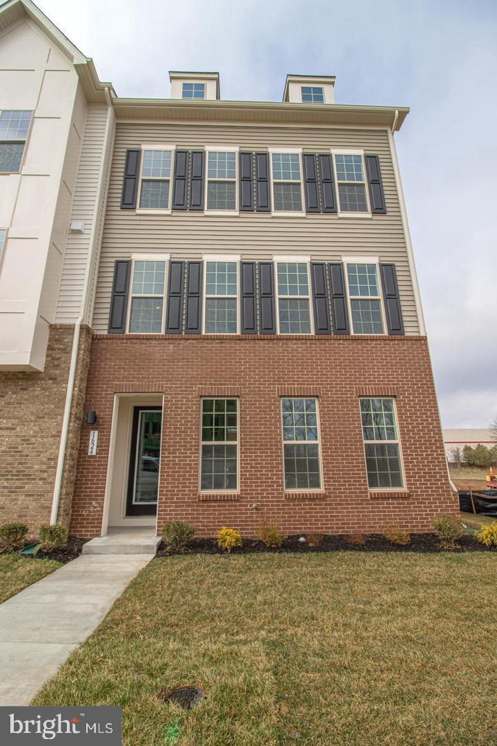 Gorgeous nearly new End unit townhouse in the heart of Leesburg Suburban shopping district. Close to Leesburg Bypass, Rt 15, 267 and Rt 7. 17 minutes to Dulles Airport. This home offers 3 bedrooms, 3 full and 1 half baths. The first floor has a sun-filled rec room, walk in closet and a full bath. The oversized 2 car garage allows plenty of room for 2 cars, plus offers some storage space. Upstairs, the open main floor boasts a great room, dining area, center gourmet kitchen with a large 2 sided island, quartz countertops, 42" cabinets, soft close drawers, & upgraded stainless steel appliances. The foyer along with the entire middle level, and the upper level hallway and staircases are all planked with stunning engineered hardwood flooring. The primary suite offers a large walk in closet with luxurious en suite bath that has dual sinks, private toilet and a gorgeous oversized shower. There are 2 additional spacious bedrooms on the upper level, a full hall bathroom and a laundry closet.