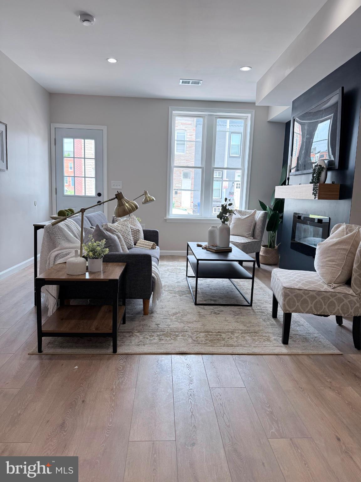 Welcome to this stunning, newly renovated townhouse offering over 1,500 square feet
of beautifully finished living space in one of Baltimore City’s most exciting and rapidly
revitalizing neighborhoods, just minutes from Johns Hopkins Hospital. This spacious
four-bedroom, three-and-a-half-bath home seamlessly blends modern finishes with
functional design and exceptional city convenience. Step inside to an inviting open-
concept main level, perfect for entertaining and everyday living. The sun-filled living and
dining areas flow effortlessly into a gourmet kitchen featuring sleek quartz countertops,
premium cabinetry, stainless steel appliances, and ample workspace for the home chef.
Just beyond the kitchen, you’ll find a convenient half bath, perfect for guests, along with
direct access to the rear deck—an ideal space for relaxing, grilling, or enjoying your
morning coffee. The upper level features a spacious primary suite complete with its own
private en-suite bathroom, creating a comfortable retreat. A generously sized second
bedroom is served by a well-appointed full bathroom located in the hallway, providing
convenience for both residents and guests. The fully finished lower level adds incredible
versatility, featuring a full bathroom, laundry area, two additional rooms, and a separate
entrance—ideal for an in-law suite, guest quarters, home office, or potential rental
opportunity (buyer to verify permitted uses).Outside, enjoy the convenience of a private
parking pad, along with plentiful street parking. Ideally located near Johns Hopkins
Hospital and surrounded by ongoing neighborhood revitalization, you’ll be just moments
from Eager Park, Starbucks, neighborhood cafés, restaurants, and community green
spaces. The Inner Harbor, Fells Point, and downtown Baltimore are all just minutes
away, offering easy access to some of the city’s best dining, entertainment, and cultural
attractions. Don’t miss this opportunity to own a beautifully renovated home in one of
Baltimore City’s fastest-growing neighborhoods.