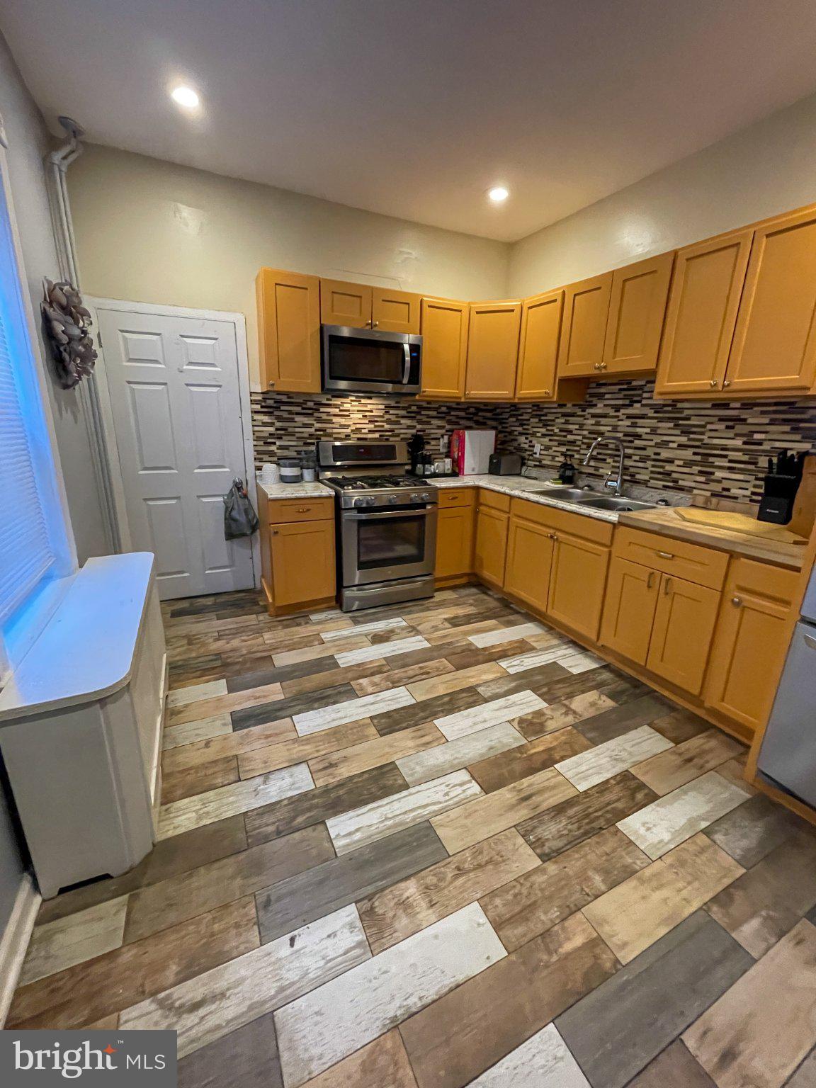 Discover an exceptional investment opportunity in the heart of West Philadelphia! This charming 4-bedroom, 1-bathroom interior row townhouse, built in 1925, combines classic architectural style with modern amenities, making it a prime candidate for both rental income and long-term appreciation. Step inside to find a spacious layout featuring built-ins and a cozy fireplace, perfect for creating an inviting atmosphere. The well-appointed kitchen boasts stainless steel appliances, ensuring durability and appeal to potential tenants. The luxurious soaking tub in the bathroom adds a touch of elegance, enhancing the property's desirability. With a full basement, there's ample storage or potential for additional living space, increasing the property's value. The ceiling fans throughout provide comfort and energy efficiency, appealing to eco-conscious renters. Located just minutes from major transportation hubs, including a commuter rail station and bus stops, this property offers convenience for those commuting to the city. The on-street parking adds to the accessibility, making it attractive for a wide range of tenants. Investing in this property not only secures a solid rental income but also positions you in a growing neighborhood with significant potential for appreciation. Don't miss out on this opportunity to enhance your portfolio with a property that combines charm, functionality, and strategic location!  The current tenant is currently paying $2400 and wouldn't mind staying if possible