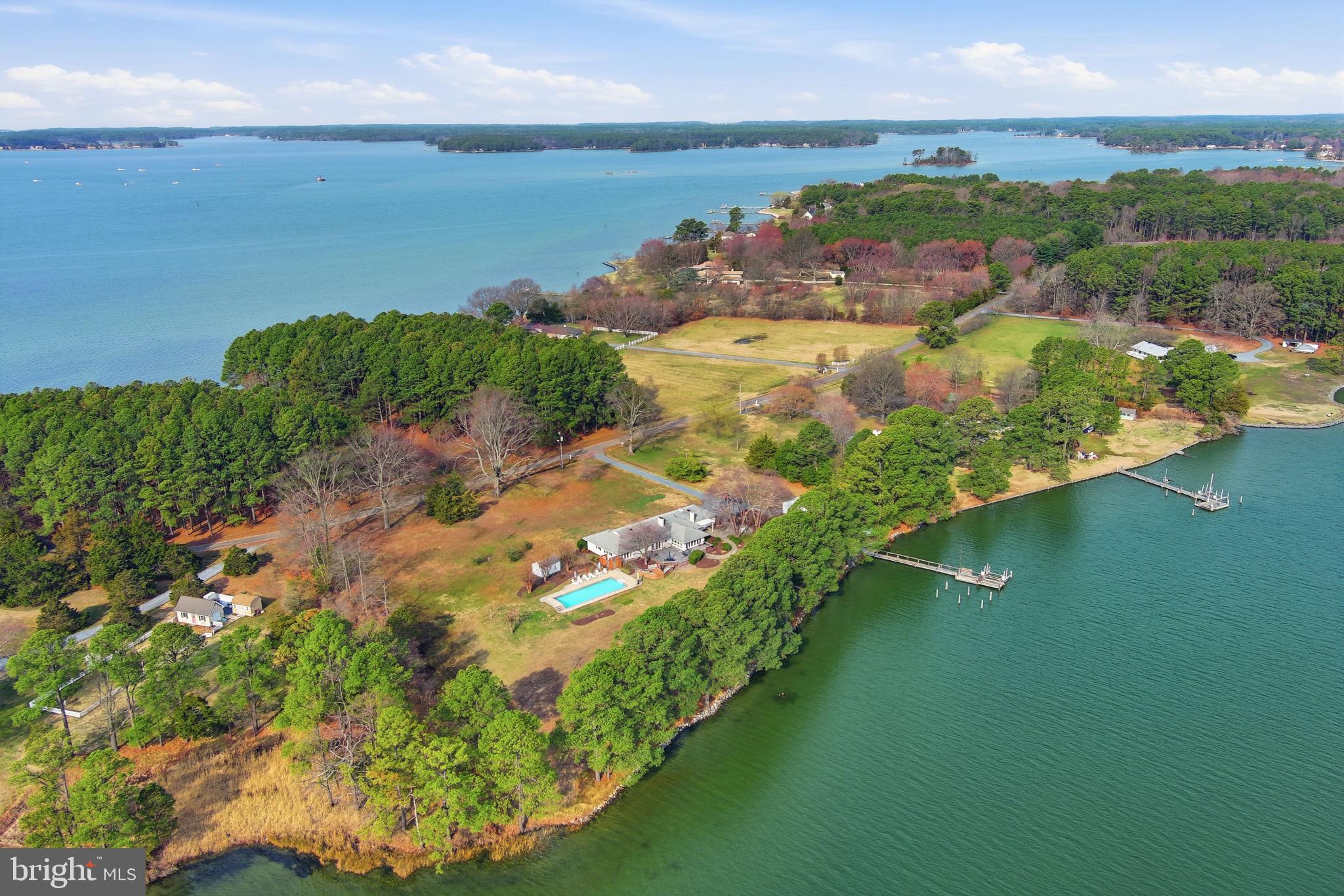 ST MICHAELS TUCKED AWAY ON DESIRABLE DRUM  POINT NEIGHBORHOOD, MINUTES FROM THE BUZZLING TOWN OF ST MICHAELS AND ITS MANY RESTAURANTS, SHOPS , CAFES, THE MOTOR MUSEUM AND THE CHESAPEAKE BAY MARITIME MUSEUM.  WHERE EVER YOU TURN YOU SEE WATER.  FEEL THE BREEZES , LOUNGE BY THE POOL OR NAP IN YOUR HAMMOCK UNDER THE SHADY TREES BY THE SHORELINE. 
THIS THREE BEDROOM SOLID BRICK HOME WITH OPEN FLOORPLAN  , DOUBLE SIDED FIREPLACE , WOOD FLOORS , RENOVATED BATHROOMS AND KITCHEN , GEOTHERMAL HVAC IS ALL ABOUT EASY LIVING AND TAKING ADVANTAGE OF THE OUTDOORS. CHARMING PATIO WITH STONE WALLS , DECK WITH OUTDOOR KITCHEN, HOT TUB . STEPPING DOWN TO THE OUTDOOR SHOWER AND SWIMMING LAPS IN THE POOL. THE DOCK OFFERS 3 MLW, A BOATLIFT AND  BOAT LAUNCH .
THERE IS A 2 ROOM STUDIO WITH COVERED PORCH TO ENJOY THE WATER VIEWS.
ENCAPSULATED CRAWLSPACE AND MANY UPGRADES.
EASTERN SHORE LIVING AT ITS BEST.