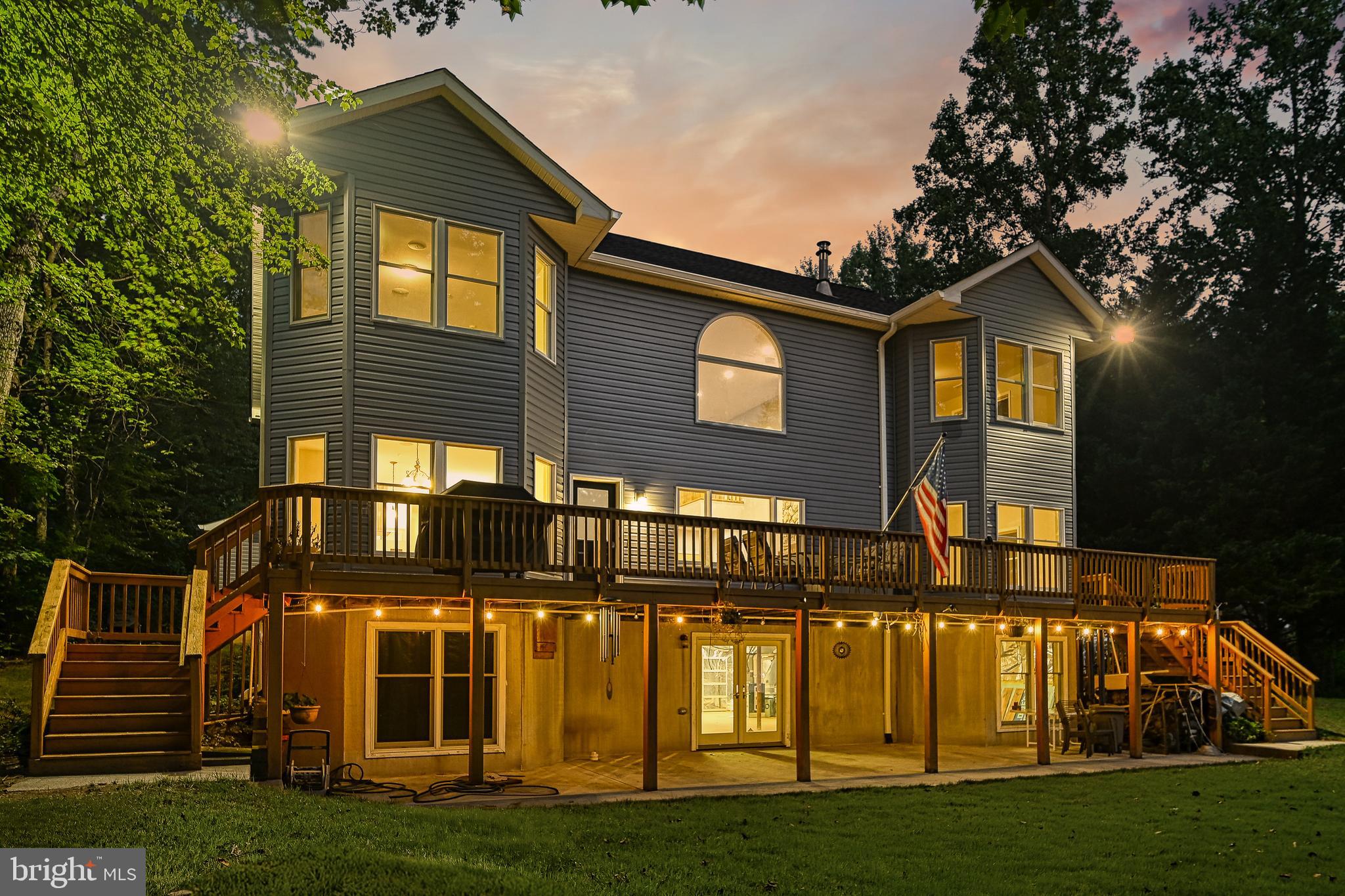 WATERFRONT on LAKE ANNA'S PUBLIC SIDE with 400' of shoreline!  This beauty has just undergone  $150k whole-house renovation, including: NEW ROOF, NEW SIDING, SOFFITS & SHUTTERS, entire interior: freshly painted walls and trim.  Gorgeous Hardwood floors in many rooms, and NEW LUXURY VINYL PLANK FLOORING blends beautifully in other rooms.  Kitchen: complete remodel including: painted cabinets and NEW GRANITE COUNTERS, NEW STAINLESS APPLIANCES, including a gas cook-top with elegant and modern glass hood vent above the kitchen island.  Expansive floor plan offers 4 true bedrooms, with the possibility of 5-6!  The downstairs Bedroom/Office combination could be converted into a main-level Master Suite OR two separate bedrooms.  The upstairs room currently being used as a utility room could also be a bonus bedroom if laundry were to be relocated back to the main level (hook-ups exist!).  Existing Master Suite is on the second floor and has a brand-new custom tiled and glass shower, new luxury vinyl flooring and new double vanity with granite top.  Two other bedrooms on the second floor have new carpet and share a Jack & Jill Bathroom.  The wrap-around balcony is open to the two-story living room with floor-to-ceiling stone (gas) fireplace.  Home Automation System – Three possible modes based on new owner preferences.  Attached 3-car garage connects to the main house with a breezeway. The best parts: STUNNING LAKE VIEWS from almost every room, a private 400' of rip-rapped shoreline, a private natural beach, and NO HOA!!  High-speed COMCAST INTERNET!  Bring your imagination for endless possibilities in the unfinished basement.  What would you do with an additional 2144 sq. feet?!  Another possible bonus: the huge walk-up unfinished attic. Agents, see attached documents OR buyers, contact an agent for complete information on all of the home's systems and features.