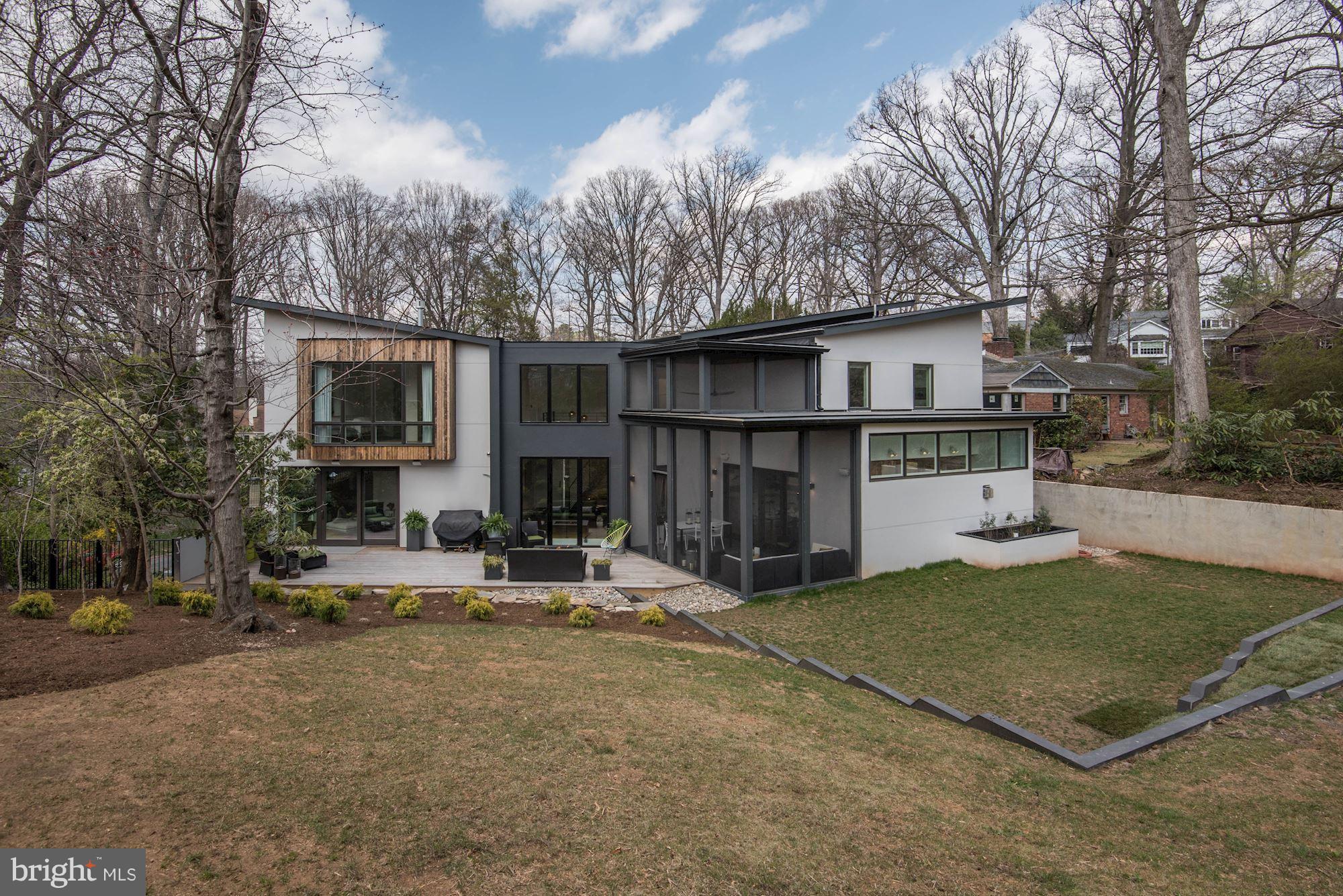 Open Sat. 1-4pm.Luxury Modern home built by Sagatov Design+Build w/designer finishes and high end details. Open main level includes a double kitchen island w/waterfall carerra marble counter tops, vaulted screened in porch off familyroom/kitchen, lounge with drybar & main level BedRm/office w/full BA. Stunning owner's suite w/floor to ceiling windows & gas FP, luxury baths,  in-law suite!