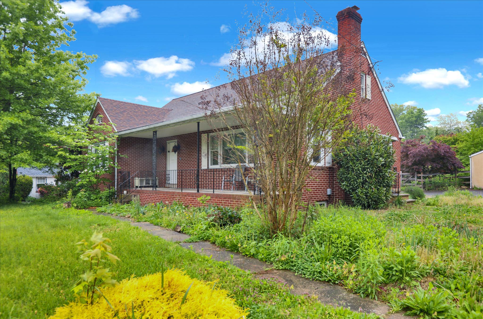 Nestled on a generous almost 1/2-acre lot, this charming 5-bedroom, 2-bathroom traditional brick home exudes warmth and character.There are 3 Bedrooms on the main floor and 2 generous rooms/bedrooms on the 2nd floor. Built in 1950, it offers a delightful blend of classic architecture and modern comforts. The inviting living space features a cozy brick fireplace, perfect for gathering with loved ones on chilly evenings. The fully finished basement, with an outside entrance, provides ample room for recreation or storage, making it a versatile addition to your home.**There is also a full bathroom in the basement. The property boasts a detached garage with space for two vehicles, ensuring convenience and ease. Enjoy the serenity of your expansive yard, ideal for outdoor activities, gardening, or simply unwinding in nature.  Residents benefit from nearby parks, perfect for leisurely strolls, picnics, and playtime. Don't miss your chance to make this property your own! Home is in need of some TLC and the price reflects that. Make your appt today!!