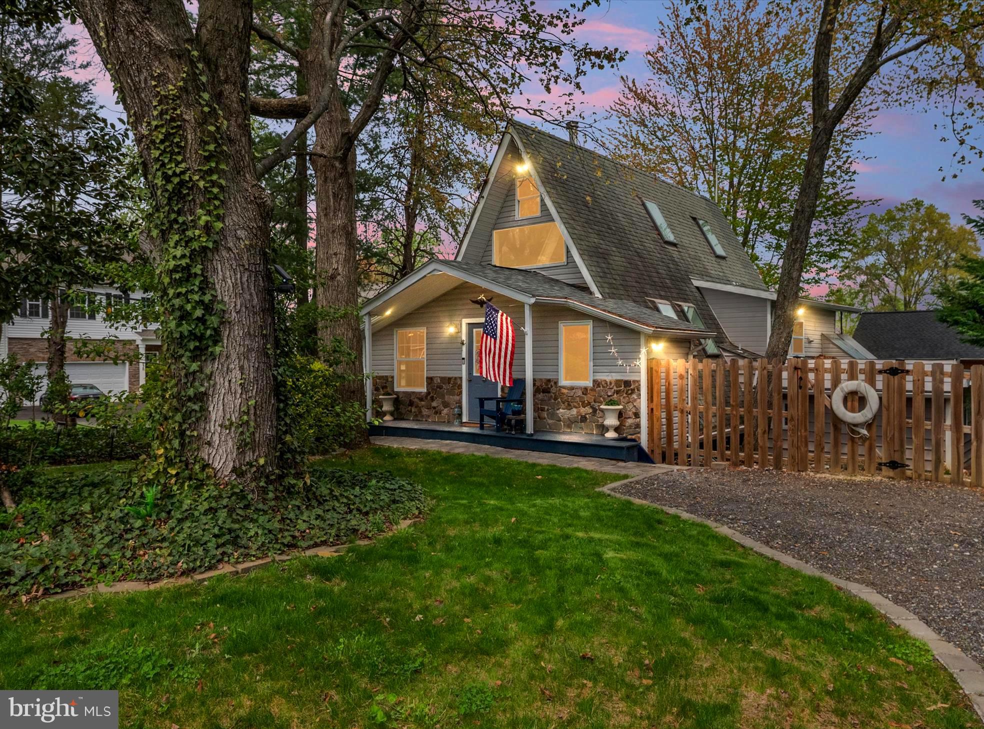 A rare gem in a water privileged community, this architecturally striking A-frame home has been fully rebuilt and thoughtfully renovated, blending both modern craftsmanship with cabin-like charm, making it the perfect cozy home, weekend escape, or incredible Airbnb investment! Soaring cathedral ceilings, exposed beams and sun-soaked skylights set a one-of-a kind tone.  The open concept living and dining space is anchored by a Pennsylvania wood-burning stove with custom built-ins maximizing storage in a seamless design throughout. The fully renovated kitchen offers BRAND NEW smart appliances, granite counters, open shelving and clever extras like a roll-out pantry, appliance lift, and peninsula with bar seating! The primary suite is an unexpected retreat, featuring lighted tray ceiling, dual closets, and sliding doors to a private covered deck. The spa-inspired ensuite bath boasts a floor-to-ceiling tiled shower with dual shower heads, full-length niche, bench, along with a double vanity! Climb the ladder-accessible loft, the perfect place for a guest nook, creative workspace, or cozy reading hideaway under the skylights! The lower level offers more flexibility and can be used as a second bedroom, large studio, or recreation room, complete with a full bathroom, laundry area, kitchenette, and its own walk-out access! Outside, enjoy the peaceful patio, covered front porch, and private fence that wraps around the corner lot in coastal charm.  Bonus features include: 1 car garage, huge carport, spacious storage shed, and reverse osmosis system in kitchen--plus all major mechanical upgrades already done: new water heater (2023), UV light, water softener, pressure switch, pressure tank, and well pump! The yard is a true delight with a sunny sectioned garden and an amazing mix of edible and ornamental plants: jalapenos, basil, mint, blueberries, blackberries, wildflowers, banana trees, pine trees, and even a Venus flytrap! There's even a matching bunny-A-frame in the yard for your furry friends! Small gated courtyard for pets with premium grass that leads to the AC controlled garage! Enjoy ALL that Selby on the Bay has to offer, including a waterfront clubhouse, beach, playground, boat ramp, and marinas for both sail and power boats. Whether you're looking for a peaceful full-time retreat or a short-term rental with a serious WOW factor, this home is ready to impress! Come fall in love and make it yours! **VA ASSUMABLE LOAN!**