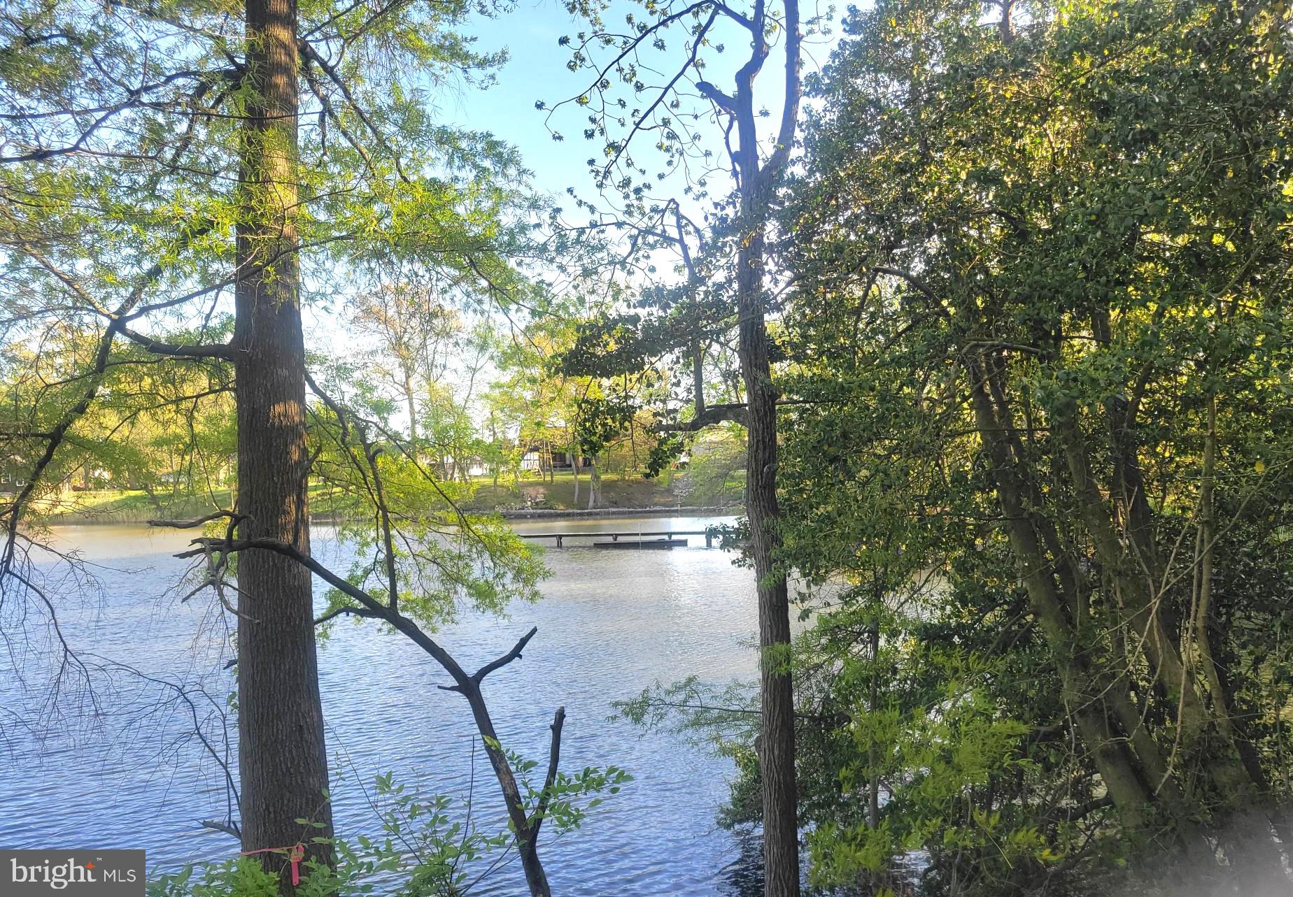 The Google Map attached to this listing is incorrect.  There is an outlet from this cove into Middle River. Look at the Satellite Map.
 PRICE REDUCTION makes this property a real deal!! Over a half  acre of private water front  with a tranquil view on a peaceful cove of the Middle River.  Located at the end of the street, it is nevertheless close to many conveniences including the MARC train station, Martin Airport, I-95 and Rocky Point Golf Course. The sellers were almost ready to build when their plans changed.  The property is preliminarily approved for construction of a charming  3 bedroom home with a porch and a detached garage. (see plans in the document section)  A dock is also approved.  Most of the development process is completed and ready for construction. The buyer must pay the environmental easement fee.  (call listing agent for more details). This is not a boring flat empty lot.  It looks like part of a park. The property has public  water and sewer.  No grinder pump is required for the sewer. Please review the attached documents before viewing. This is a lovely older waterfront community with no HOA.