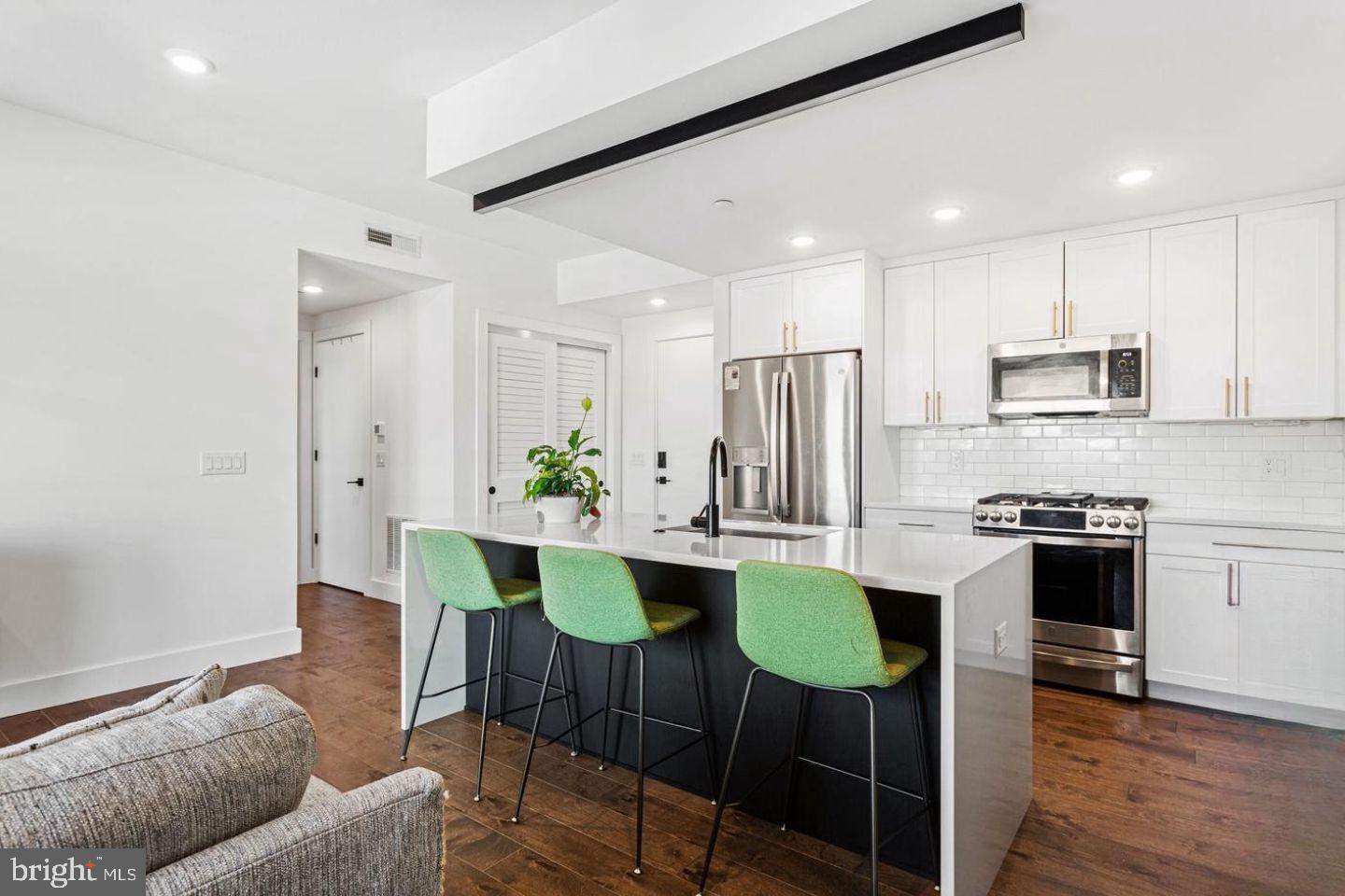 Welcome to The OTTO! Located at 31st and Jefferson, a lovely tree-lined corridor surrounded by other new developments, this area is one of the most excellent pockets of Brewerytown!!  With an eclectic appeal and artistic style, low condo fees and deeded parking, this large  2 building condominium offers safety, convenience and community.  This 1-bedroom, 1-bath condo is 3 years young with a smart, open layout designed for both comfort and style, complete with a private terrace—perfect for morning coffee or evening unwinding. The home is filled with natural sunlight from large windows, creating a bright and inviting atmosphere throughout. Inside, you’ll find hardwood and tile flooring, sleek modern appliances in unit laundry and gas cooking, delivering both everyday efficiency and elevated design.
The elevator building provides easy, convenient access to your unit, while residents also enjoy a community roof deck with greenery, lounge chairs, a dog run and an outdoor kitchen, it’s an exceptional space for entertaining, relaxing, and taking in the expansive skyline views. A gated, deeded parking space adds everyday convenience and long-term value—a true luxury in the city. Even better, the property comes with approximately 7 years remaining on the tax abatement, keeping monthly costs impressively low.
Location truly sets this home apart. You’re just steps from local favorites like OTTO’s Taproom Grille, Blue Jay, and Green Eggs Cafe. Outdoor enthusiasts will love the close proximity to Strawberry Green Driving Range, Fairmount Park, Art Museum, Kelly Drive, and iconic Boathouse Row. 
Whether you’re a first-time buyer, investor or are looking for a pied-à-terre, this condo delivers new construction quality, sun-filled interiors, high-end finishes, elevator access, strong tax advantages, and an unbeatable lifestyle location—schedule a tour and let the experience speak for itself!
