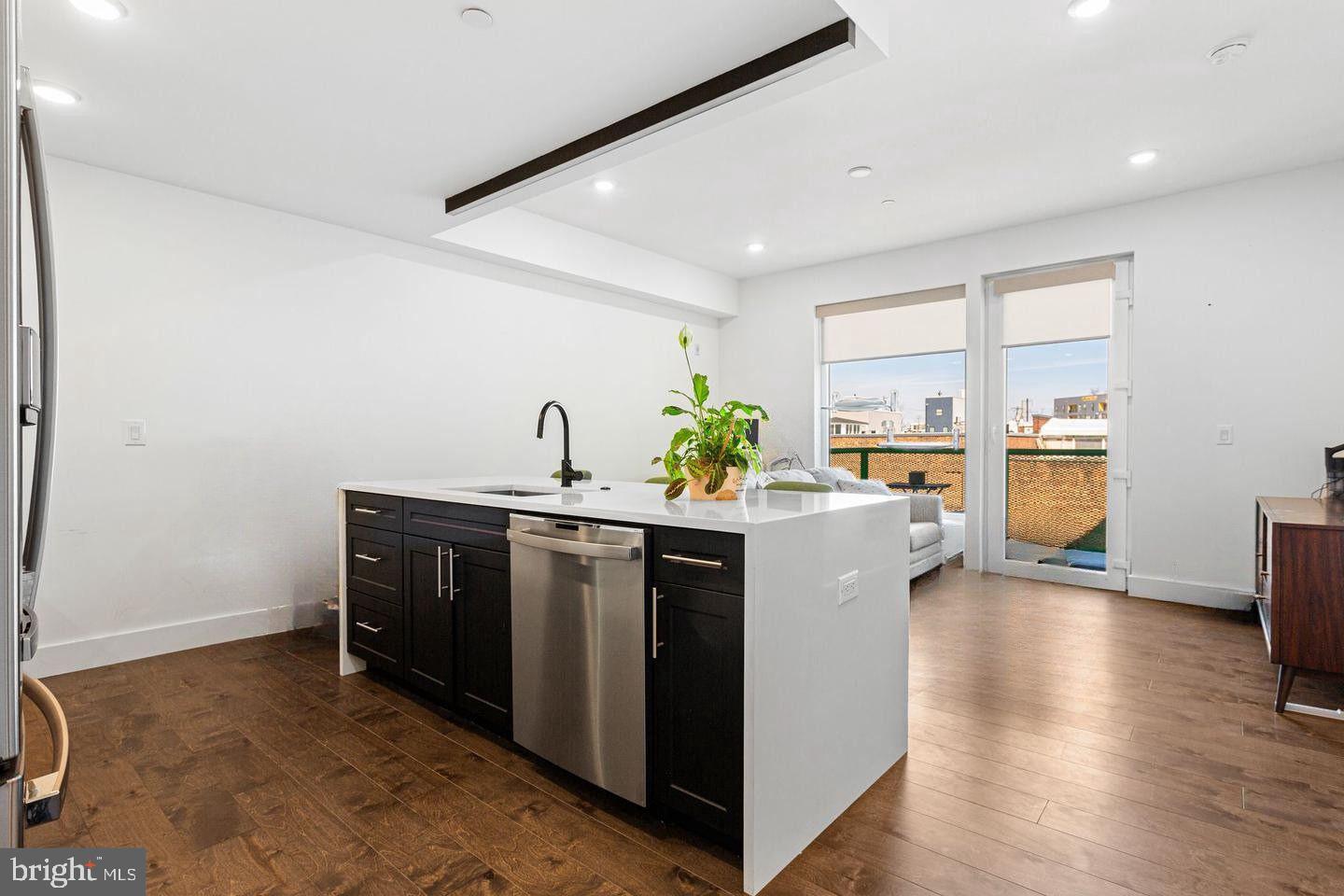 Welcome to The OTTO! Located at 31st and Jefferson, a lovely tree-lined corridor surrounded by other new developments, this area is one of the most excellent pockets of Brewerytown!!  With an eclectic appeal and artistic style, low condo fees and deeded parking, this large  2 building condominium offers safety, convenience and community.  This 1-bedroom, 1-bath condo is 3 years young with a smart, open layout designed for both comfort and style, complete with a private terrace—perfect for morning coffee or evening unwinding. The home is filled with natural sunlight from large windows, creating a bright and inviting atmosphere throughout. Inside, you’ll find hardwood and tile flooring, sleek modern appliances in unit laundry and gas cooking, delivering both everyday efficiency and elevated design.
The elevator building provides easy, convenient access to your unit, while residents also enjoy a community roof deck with greenery, lounge chairs, a dog run and an outdoor kitchen, it’s an exceptional space for entertaining, relaxing, and taking in the expansive skyline views. A gated, deeded parking space adds everyday convenience and long-term value—a true luxury in the city. Even better, the property comes with approximately 7 years remaining on the tax abatement, keeping monthly costs impressively low.
Location truly sets this home apart. You’re just steps from local favorites like OTTO’s Taproom Grille, Blue Jay, and Green Eggs Cafe. Outdoor enthusiasts will love the close proximity to Strawberry Green Driving Range, Fairmount Park, Art Museum, Kelly Drive, and iconic Boathouse Row. 
Whether you’re a first-time buyer, investor or are looking for a pied-à-terre, this condo delivers new construction quality, sun-filled interiors, high-end finishes, elevator access, strong tax advantages, and an unbeatable lifestyle location—schedule a tour and let the experience speak for itself!