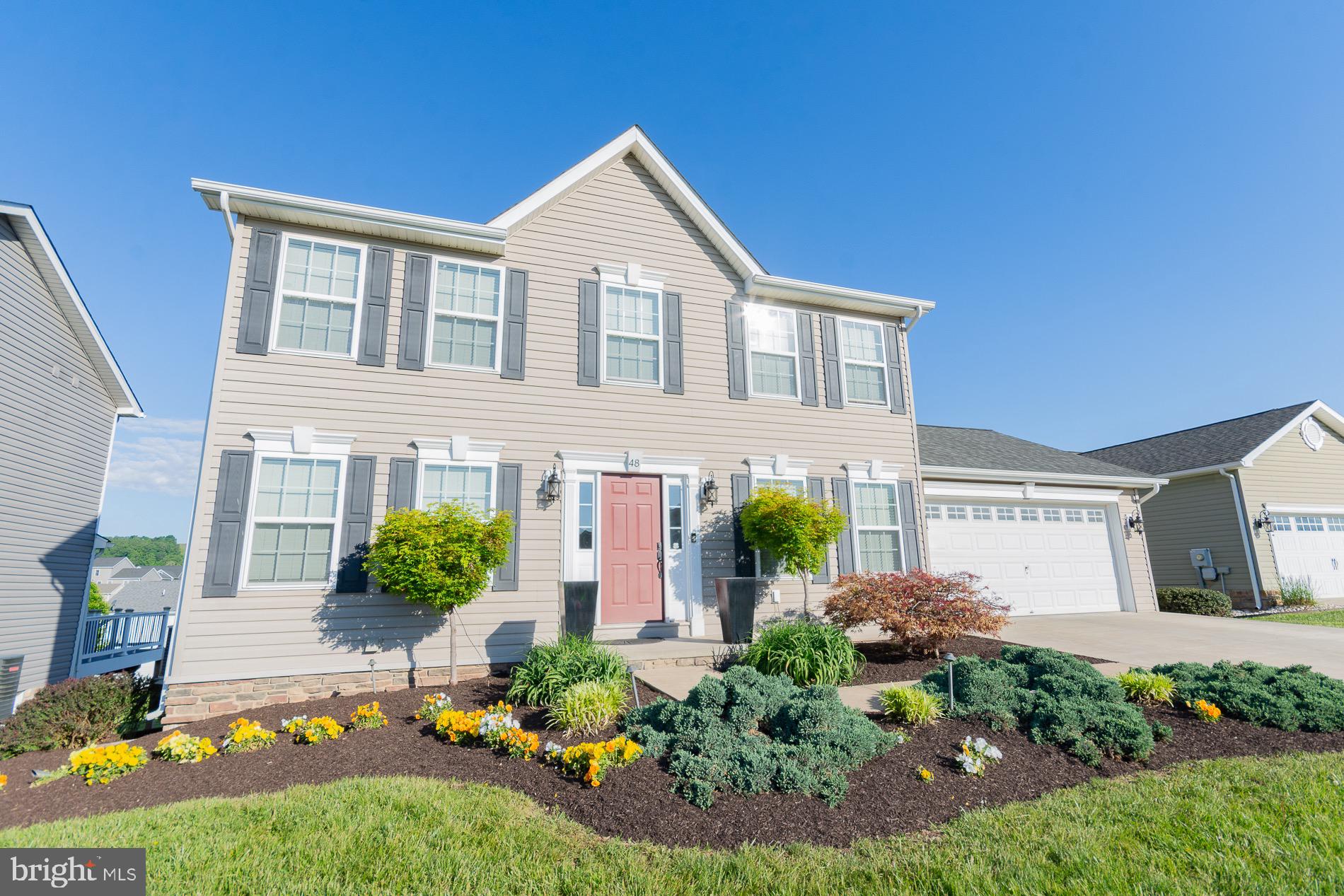 Perfectly positioned in the sought after Red Hill subdivision near Martinsburg and Hedgesville, this beautifully maintained and truly turn-key home offers the ideal blend of comfort, space, and convenience across three finished levels. Featuring 3 bedrooms, 3.5 baths, and over 2,500 finished square feet, this home is designed to fit today’s lifestyle with room to relax, entertain, and work from home.  Step inside and immediately appreciate the abundance of natural light that fills the home throughout the day. The inviting main level offers a welcoming foyer, private den/office, elegant separate dining room, spacious living room, and a stylish country kitchen complete with island, backsplash, and appliances that make meal prep and gatherings effortless. A convenient half bath rounds out the main level.  Upstairs, the spacious primary suite serves as a peaceful retreat featuring a luxurious bath with soaking tub, walk-in shower, dual vanity, and walk-in closet. Two additional bedrooms and a full hall bath provide plenty of room for family or guests, while one bedroom showcases a charming custom built-in bed feature.  The finished lower level expands your living space with a large recreation room highlighted by a cozy gas fireplace, custom built outs, an exercise room, and an additional full bath, creating the perfect setup for entertaining, hobbies, fitness, or flexible living space. Enjoy outdoor living on the rear deck or unwind beneath the covered back patio overlooking the .18-acre lot.  Conveniently located with easy access to I-81 and I-70 and just minutes from schools, shopping, hospitals, and commuter routes to Maryland, Pennsylvania, and Virginia. Schedule your private tour today for this exceptional home in Red Hill!