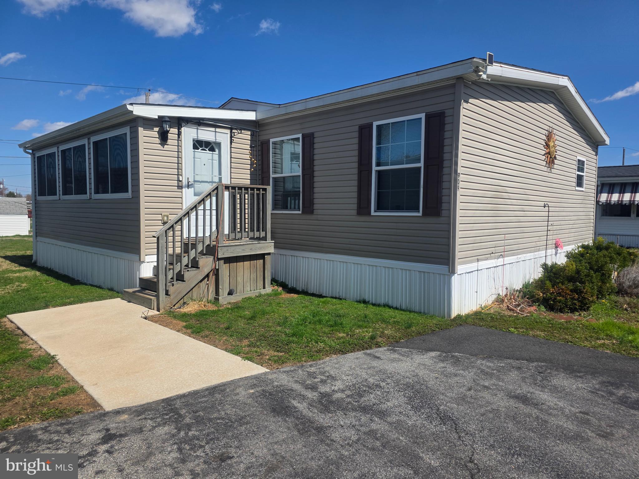 Welcome to this beautifully maintained 2016 Eagle model double-wide mobile home, offering comfort, space, and a peaceful setting. This one-owner home features 3 generously sized bedrooms and 2 full bathrooms, all in like-new condition.

Step inside to an inviting eat-in kitchen, perfect for casual meals and everyday living. The spacious layout flows seamlessly into the living area, where a cozy propane fireplace creates a warm and welcoming atmosphere. A bright sunroom addition provides the ideal spot to relax, entertain, or enjoy your morning coffee while taking in the serene surroundings.

Situated in a quiet, tranquil area of the community, this home offers both privacy and convenience. With its well-kept condition and thoughtful features throughout, it’s truly move-in ready and a must-see.

Don’t miss the opportunity to own this charming and comfortable home in a peaceful setting.