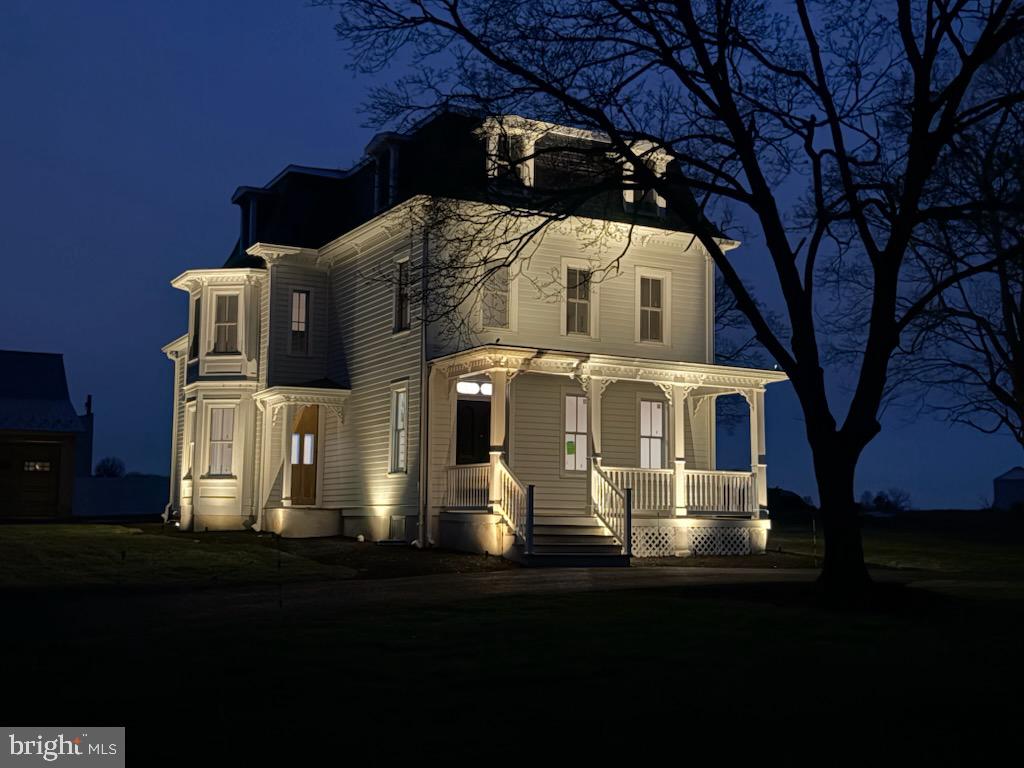 A stunning and sophisticated complete restoration of a treasured historic home built in 1877, Rose Lawn is one of the most prestigious homes in Forest Grove Village.  This beautiful 3-story house provides the benefits and peace of mind of new construction and it is ready to move into.  Lovingly restored by Nick Lykon who has completed other outstanding renovations of vintage homes, his vision was to take the architectural characteristics & ambiance of the house and  blend it with modern amenities and luxuries to create a home of exceptional beauty & style.  Many of the original period details remain and were matched where needed by custom millwork of outstanding craftmanship.  What was created is a seamless blend of the elegant architectural features that were part of this distinguished home when built plus new infrastructure parts including the roof, siding, plumbing, electric, HVAC, fire protection, and septic system. Imagine holidays in this gorgeous house!  Highlights include the original staircase that gracefully winds up to the third floor, the intricate millwork, original floors, new Marvin Elevate windows and doors (there is one remaining original window with a story), rebuilt barn and garage/workshop.  From the foyer you enter a living room with a two-sided fireplace that is also enjoyed in the family room.  Huge windows are everywhere and let in natural light and the views and beauty of changing seasons.  The family room spans the width of the house and is shared by a formal dining room at the other end.  In the middle is an incredible, original 8' pocket door. The three large main floor rooms give you the choice of how to use them for your lifestyle.  A large eat-in kitchen with wonderful Quartz counterspace and  lots of custom cabinetry is a chef's delight that combines convenience, function, and beauty. Plenty of space to hang out and to prepare food for a small or large gathering.  A door opens to the rear and  the  covered exterior  entrance to the basement.  Two staircases- the grand one in the foyer and a back one from the kitchen-take you upstairs to the first of two levels of bedrooms and bathrooms.  The two upper floors have six bedrooms and 3 full bathrooms.  The spacious primary suite has a propane fireplace, bathroom,  large walk-in shower, and there is also a room sized closet. There are two other bedrooms and a shared bathroom on this level that includes a cast iron tub next to second floor laundry.  The third floor has three more bedrooms: 3rd floor laundry and a bathroom.  The rebuilt 2-level barn is an extraordinary opportunity for use.  The large space has three huge chandeliers that set the stage for your personal needs and pleasure and /or for a business opportunity.  It could be the quintessential event and party space, a showplace for a car collection or any of many zonings potential uses.  The lower level was built to be completed for farm animals, equipment or your car collection whatever you want or need.  The 4.7 acres give you control of designing your outdoor amenities.  Or, you can even rent part of the land to a farmer.  And, there is a possibility to subdivide the land and build a second home.  Rose Lawn is not an ordinary residence or property.  It has grace, size, a historic provenance, a great location and unquestionable beauty.  You can live in the central part of Bucks County and enjoy its amenities.  Ideally located near Doylestown, New Hope, and Newtown that have shops, boutiques, restaurants, a movie theater, live performance venues, a train station and parks.  This special property has it all...welcome home!
