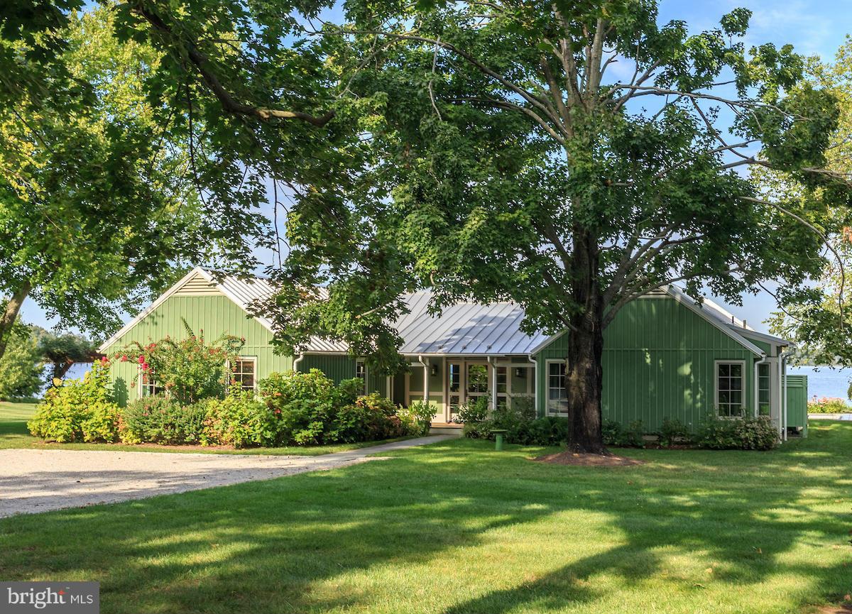 You will hear yourself say "I can't believe I live here!"  Meticulous Million Dollar renovation in 2011. Over 1200' of waterfront including a long sandy beach with replica lighthouse and wildlife wetlands. Family compound? Plans for a guest house with entertainment room adjacent to tennis court exist. A 2 acre plus building lot is available.