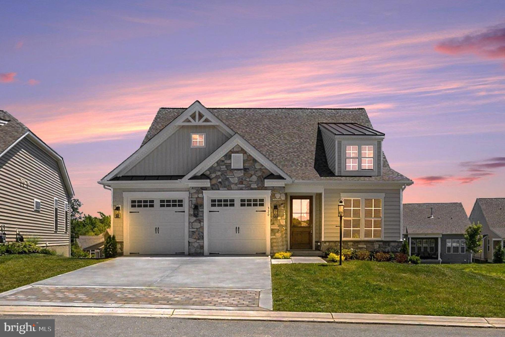 Welcome to resort-style luxury in the highly sought-after, gated Bulle Rock community! This stunning new construction by Trademark Custom Homes offers a modified "Rachel" floor plan with a custom paint palette, featuring over 2,000 sq ft of exquisite main-level living. The show-stopping living room boasts a vaulted ceiling with rustic exposed beams, a cozy gas fireplace, and a breathtaking custom stone archway that gracefully transitions into the gourmet kitchen. Entertain with ease using the state-of-the-art multi-slide glass door that seamlessly extends your living space out to a beautiful covered rear porch. The spacious main-floor primary suite is a true retreat, highlighting a spa-like bathroom with a floor-to-ceiling tiled shower and a sleek, elongated niche. The main level also includes a convenient laundry room and a versatile den enclosed by elegant glass-panel barn doors. Upstairs, you will find over 700 finished sq ft encompassing two generous bedrooms and a full bathroom. The expansive walk-out basement is currently unfinished—though it can be completed prior to settlement—and leads out to a custom sunken patio overlooking a tranquil rear yard with natural privacy screening. Embrace a low-maintenance, vacation lifestyle with HOA-provided lawn care and snow removal. Residents enjoy world-class amenities including a 37,000 sq ft Residents' Club, a state-of-the-art fitness center, indoor and outdoor pools, tennis and pickleball courts, scenic walking trails, and access to the renowned Pete Dye-designed 18-hole championship golf course.