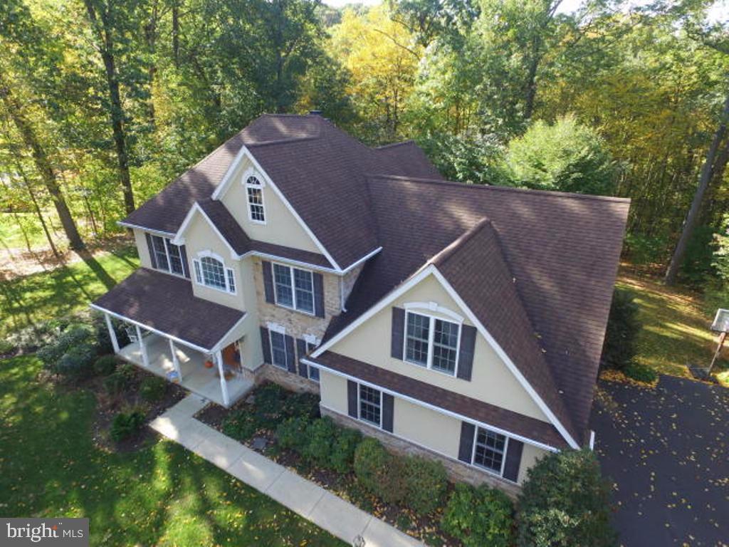 Situated on a private one acre lot, this home offers 4 bedrooms including a spacious owner's retreat. En-suite bath features tile shower, dual sinks, garden soaking tub and heated tile floors! Large, open great room with 2 story ceiling and cozy fireplace flows into the eat-in kitchen. Formal living room & dining room with hardwood floors. Full finished walk out basement w full bath.