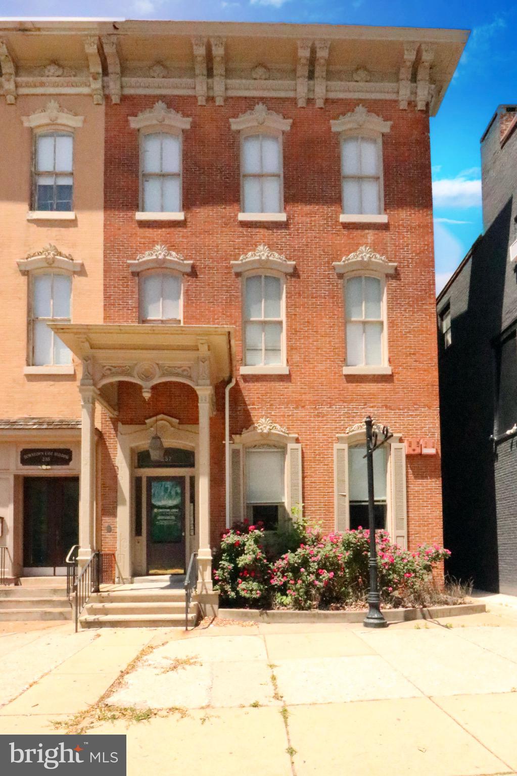 Welcome to the heart of York, PA where an incredible investment opportunity awaits you! Introducing this three-story brick building situated in a central location. This property offers a multitude of possibilities, featuring three apartments on the upper floors and a 2,000 Sq. Ft. office space on the first floor. The office space exudes a sense of professionalism and cleanliness, making it an ideal setting for any business venture. For the savvy investor, this property presents an excellent chance to generate a steady cash flow from the rents of the three apartments on the upper levels. And potentially even more cash flow once the rents are brought up to market value. Located on busy E Market Street, this building benefits from high visibility and excellent signage opportunities, ensuring maximum exposure for any business operating from the ground floor. In addition to its strategic location, this property boasts a private parking lot with seven dedicated spaces. Parking is at a premium in this area, and having ample parking options is always good! Heating system was just serviced and will be maintenance free! All city inspections have recently been passed as well! 

This remarkable building, with its prime location, value-add potential, and well-maintained apartments, offers a promising investment opportunity. Whether you are a seasoned investor or someone looking to expand their real estate portfolio, this property is not to be missed! Take advantage of this chance to capitalize on the prosperous York market and secure a lucrative source of income. Contact us today to schedule a showing!!