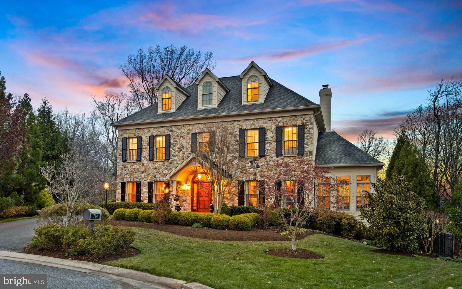 Welcome to the gated community of "The  Ridge of Ruxton"   This custom built luxury residence boasts a plethora of exquisite features and exudes elegance and sophistication. Step inside and be captivated by the spaciousness of the rooms & the meticulous attention to detail  throughout. The heart of this home lies in its well-appointed kitchen with oversized center island, custom cabinetry & top of the line appliances. The harmonious blend of this open concept gourmet kitchen seamlessly connects with the family room creating the ultimate gathering place for family and friends. The sunroom off the family room   has walls of windows providing  an abundance of natural light creates a versatile space that can be used for various purposes. Main level also features the perfectly appointed dining room & living room with custom built-ins.  Second level features the intimate primary suite  with fireplace exudes warmth and elegance  complete with two walk-in closets and luxe bath.  There are 3 additional en-suite bedrooms,  plus an office & laundry room.  The third level offers two oversized bedrooms and  hall bath. The Lower level's spacious layout provides a large second family room with full bar, a bedroom with sitting room, bath, laundry & ample storage space.  The oversized 3 car garage  provides plenty of space to park & store vehicles , extra storage and access to the mudroom that adds functionality and convenience. Now is time to  enjoy outdoor living at it's finest . The saltwater pool adds a touch of luxury while the hot tub is perfect for unwinding after a long day. The screen porch, deck and patio  allows for entertaining and the beautiful landscaping adds a touch of natural beauty, creating a serene and inviting atmosphere for outdoor living. 
All these wonderful features and amenities combined with location offers the perfect blend of  elegance and  convenience  with easy access to  shopping, schools and downtown.