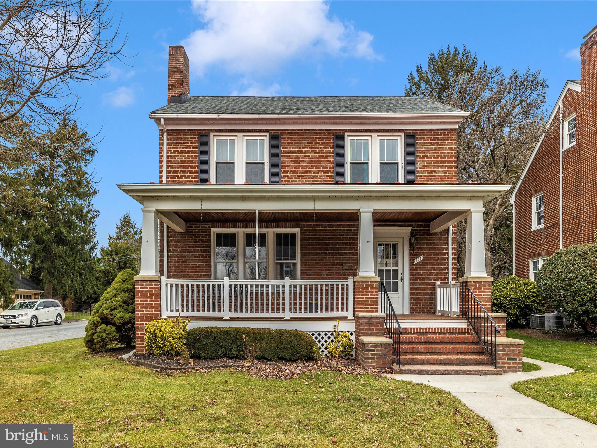 Nestled in the heart of a charming neighborhood near Baker Park and downtown Frederick, this older 4-level home exudes timeless character and warmth. The exterior of the house is brick with siding on the addition built in 1989 and has a welcoming wide covered front porch.   Upon entering the home, you are greeted by a sense of nostalgia and authenticity.   Hardwood floors cover most of the home with carpet over hardwood in the living and dining rooms only.    One of the standout features of this residence is its in-law suite. Tastefully integrated into the overall design, the suite offers a private and comfortable space for extended family, guests with ramp access from the back yard or a primary main level bedroom. It includes a small kitchenette, a cozy living area, an office and a bedroom with walk-in closet, providing both independence and a sense of connection to the main household.   You'll have plenty of storage space for all of your goodies in the walk-up attic so you can ditch your storage unit.  Car enthusiasts will appreciate the convenience of not one but two 2-car garages, providing ample space for vehicle storage and perhaps workshop space. You'll love the fenced backyard with garden boxes, a swing and a quaint patio.  The property's proximity to Baker Park and downtown Frederick is a major highlight. Residents can easily stroll to the park for leisurely walks, picnics, or community events. The vibrant downtown area beckons with its eclectic mix of shops, restaurants, and cultural attractions, ensuring there is always something fun to do just around the corner.  In summary, this older home with modern updates, lots of character and unique features offers a blend of historic charm and modern convenience in a setting close to everything!  New roof in 2016.