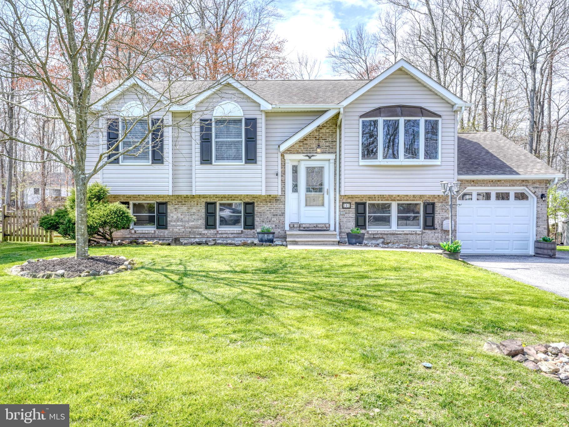 Welcome to 5 Kings Court — a beautifully renovated home on a cul-de-sac in the water-oriented community of Kensington Court in Elkton, MD. This exceptional 4-bedroom, 2 full bath home offers approximately 2,300 sq ft of thoughtfully designed living space, blending modern upgrades. 

From the moment you arrive, you’ll appreciate the attention to detail throughout. The fully updated kitchen features granite countertops, stainless steel appliances, and a clean, modern aesthetic perfect for both everyday living and entertaining. Just beyond, a spacious second family room with a custom accent wall and built-in surround sound creates the ideal setting for gatherings or relaxing movie nights.

The main level also offers a beautifully finished bathroom complete with a jetted tub and custom finishes, adding a touch of comfort and luxury.

Downstairs, the lower level presents incredible flexibility — ideal for an in-law suite, private guest quarters, or potential rental income. With its own separate entrance, dedicated living space, office area, full bathroom, and room for a future kitchenette, this space is perfectly suited for multi-generational living or passive income opportunities.

Additional highlights include two laundry areas - 1 on the main level & 1 on the lower level, a bonus room perfect for a home gym, man cave, or creative studio, and a layout designed to adapt to your needs. Step outside to enjoy a private backyard retreat featuring a concrete patio, gazebo, fire pit, and peaceful wooded views — perfect for relaxing or entertaining year-round.

As a resident of Kensington Court, you’ll enjoy access to a private beach, boat ramp, and scenic walking path. The home includes fully owned solar panels, providing energy efficiency and long-term savings.

Move-in ready and loaded with possibilities, this is a rare opportunity you don’t want to miss. Schedule your private showing today and experience everything 5 Kings Court has to offer.