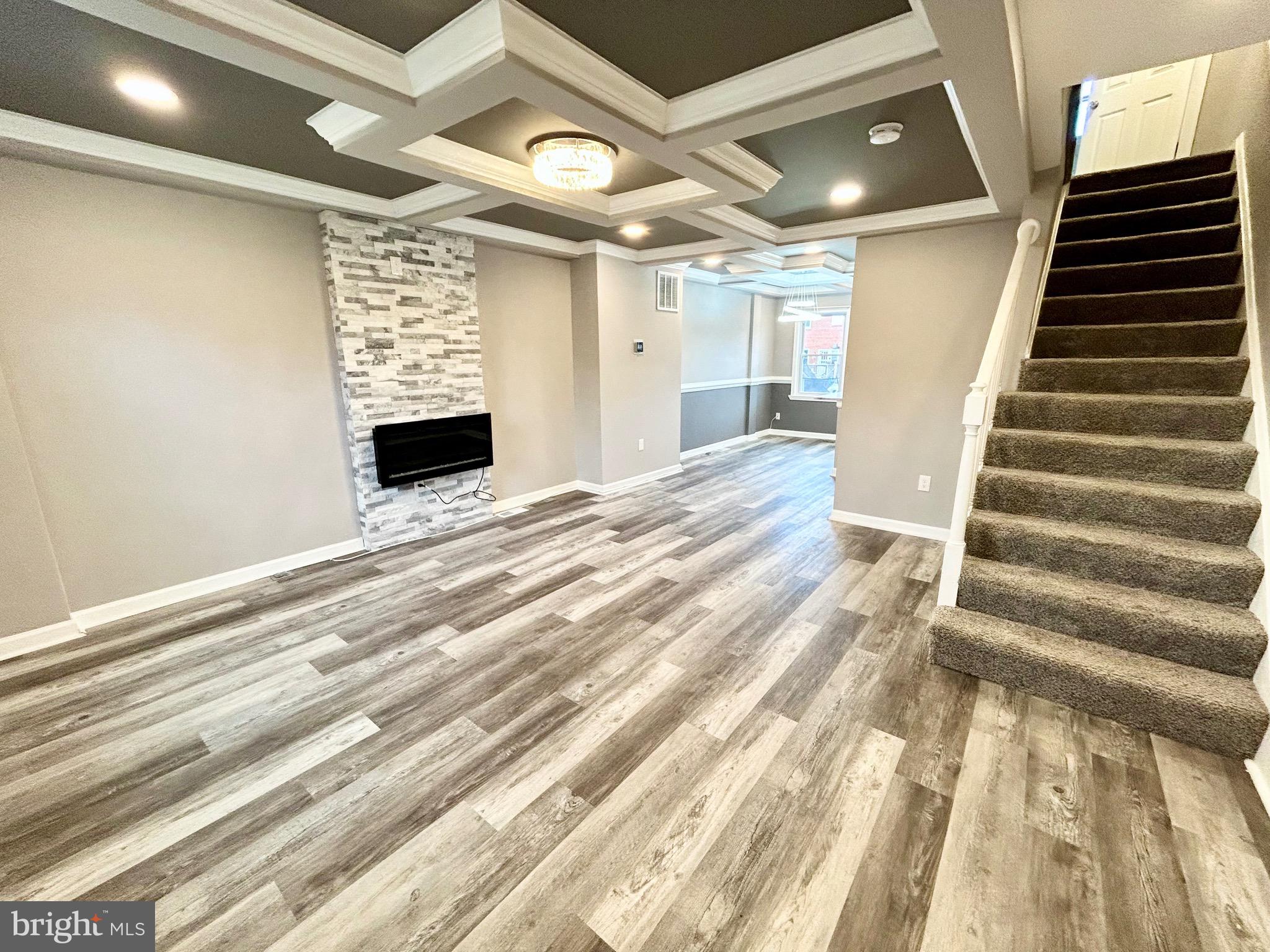 Beautifully renovated townhouse in a convenient location! Walk in to the the open concept main level welcoming you to the living room with a cozy fireplace insert. The stylish dining area provides a bright and inviting space which leads to the luxury kitchen boasting stainless steel appliances, 42" cabinets, ceramic floors, and granite countertops. Off of the kitchen you can access the rear deck and backyard which includes a one car parking pad. Upper level presents three carpeted bedrooms with a full bath. Spacious fully finished basement features laundry room and full bath. Make this your new home! No pets and no smoking. **All applicants are required to have at least a 640+ credit score and verifiable proof of income three times the monthly rent. Each tenant above the age of 18 is required to complete a separate application.