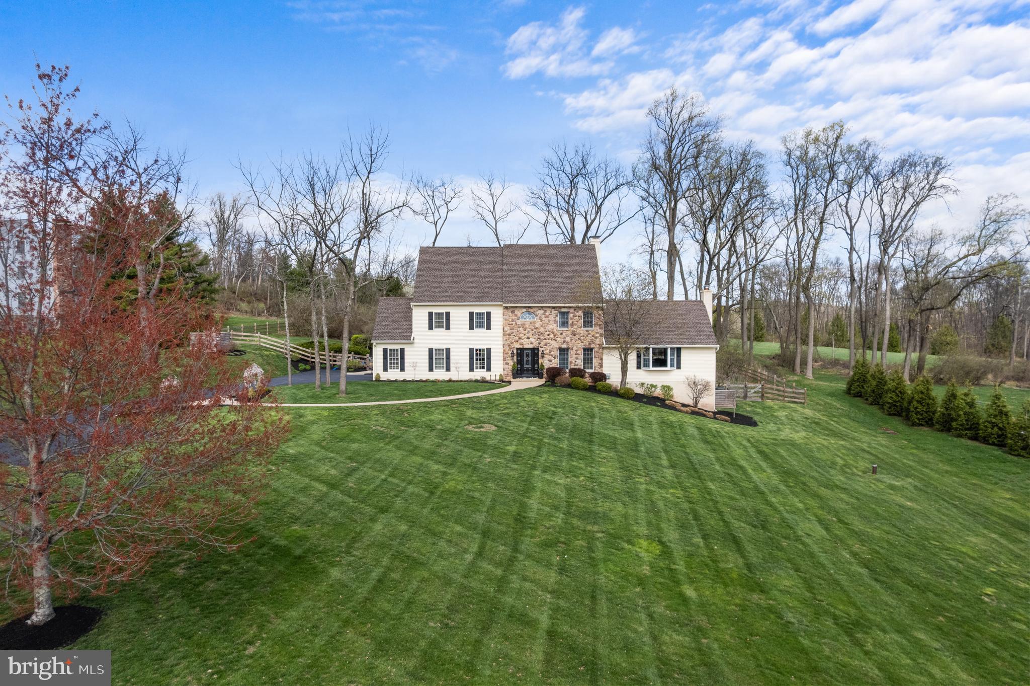 This is a Bucks County dream home and property, and it can be yours!!! GORGEOUS UPDATED Custom-Built Fox Hunt Estates Home with 4 bedrooms on a 1.56 Acre premium lot that backs to picturesque preserved farmland. The resort like backyard features a custom heated salt water POOL with natural stone waterfall, connected hot tub, multiple outdoor speakers and firepit for year-round enjoyment. The newly fenced backyard has extensive landscaping, hardscaping with multi-level entertaining spaces that include pool deck, sunken patio adjacent to pool and a huge deck on the back of the house with double entrances to the kitchen and family room. Walk up the custom stamped concrete front walkway with lush landscaping on either side. Step inside the front foyer with gleaming 5-inch plank champagne maple wood flooring that leads you throughout the perfectly decorated main floor.  Every detail of this home has a designer’s touch in finishes, furnishings, lighting, paint, flooring and more. The kitchen and breakfast room with sitting room and stone fireplace are remodeled and everything about this space is luxurious. The great room/family room is a 520 SF showstopper with 18' vaulted ceiling and a stone floor-to-ceiling fireplace with a new Mendota (top of the line) gas fireplace insert (2023)! This stunning room is light filled with gorgeous windows on three sides including a large bay window, and skylights. There is access to the large 535 SF deck from the family room.  The entire first and second floor were repainted top to bottom with a modern neutral color palette. All the white trim and molding you see today was previously dark stained wood. Take the custom black and white finished solid wood staircase to the second floor where you will find new wood flooring throughout the hallway. This living space of the home offers 4 bedrooms and 2 full baths and updated laundry center with cabinetry and a sink. The master suite offers a desirable open floor plan with a sitting area, large walk-in closet and ensuite bathroom.  The master bath features a long double sink vanity with granite countertop and custom finished cabinetry, jetted tub, spa like tile shower with seat and frameless glass door and a linen closet.  The remaining bedrooms are all very spacious with abundant closet space. The fully remodeled (2023) hall bath features double sink vanity with Carrera marble countertop, new bathtub with tile surround and large niche for storing shower essentials.   There are pull downstairs to a large partially floored attic. The WALKOUT basement offers a secondary family room with brand new carpet(2025), pool table, home gym, workshop nook and large storage area. This home also features a newer roof (2013), new expanded and paved driveway with additional parking pad (2013), central vacuum and many other custom features. Fox Hunt Estates is sought after for its custom-built homes, large lots, views, mature tree lined streets, pristinely kept neighborhood, NO HOA, and central Bucks Schools with a Doylestown address. Just 10 minutes to the Doylestown Borough for dining and shopping, multiple grocery stores within 5-7 minutes and much more. Located in the Central Bucks School District and close to commuter routes to Philadelphia, NJ and NYC. Schedule your showing today….this one will not last long!!! Showings start on Thursday, April 10 at 10 AM.