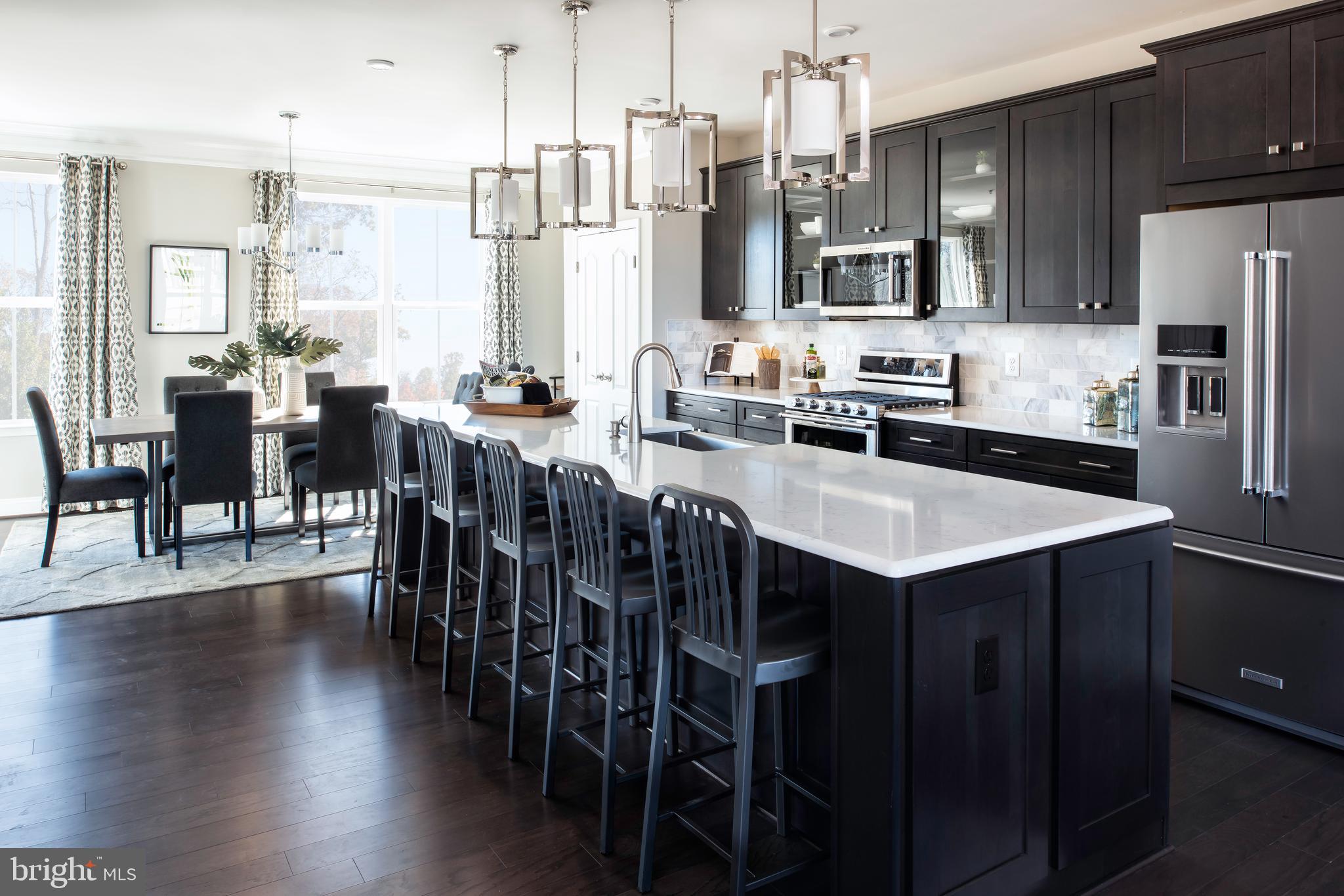 Introducing the Patuxent at Taylor Highlands—a spacious, versatile townhome designed for buyers who want more room to live, work, and entertain. This expansive floorplan features open, inviting main living areas that seamlessly connect the kitchen, dining, and great room, creating a comfortable flow for everyday living and gatherings. The home is thoughtfully designed with well-separated living spaces, including an entry-level recreation room or an optional guest suite, providing flexibility for multi-generational living, guests, or a private home office. Upstairs, the generously sized bedrooms—including a luxurious primary suite—offer both comfort and privacy. A full two-car garage provides added convenience and storage rarely found in townhome living. Taylor Highlands is a new phase of a well-established community in Ellicott City, allowing homeowners to enjoy both new construction and access to existing amenities including a pool, clubhouse, fitness center, tennis courts, and tot lot—with exciting future enhancements planned, including a new clubhouse, pool, and gathering spaces. With easy access to Routes 40, 29, and I-70, plus nearby shopping and dining, the Patuxent offers a rare opportunity to own a larger, more spacious townhome in one of the area’s most sought-after locations. *Beazer Homes is proud to be America’s #1 Energy‑Efficient homebuilder. Our FY25 average gross HERS score of 32 (38 excluding solar) was the lowest of the publicly reported scores among the top 30 U.S. homebuilders by volume identified by Builder Magazine’s Top 100 List (based on 2025 total closings) ** This listing represents the base price for a Patuxent Model home on a to-be-built lot. *** Photos are of the model home.  **** Pricing, features, and availability are subject to change without notice.