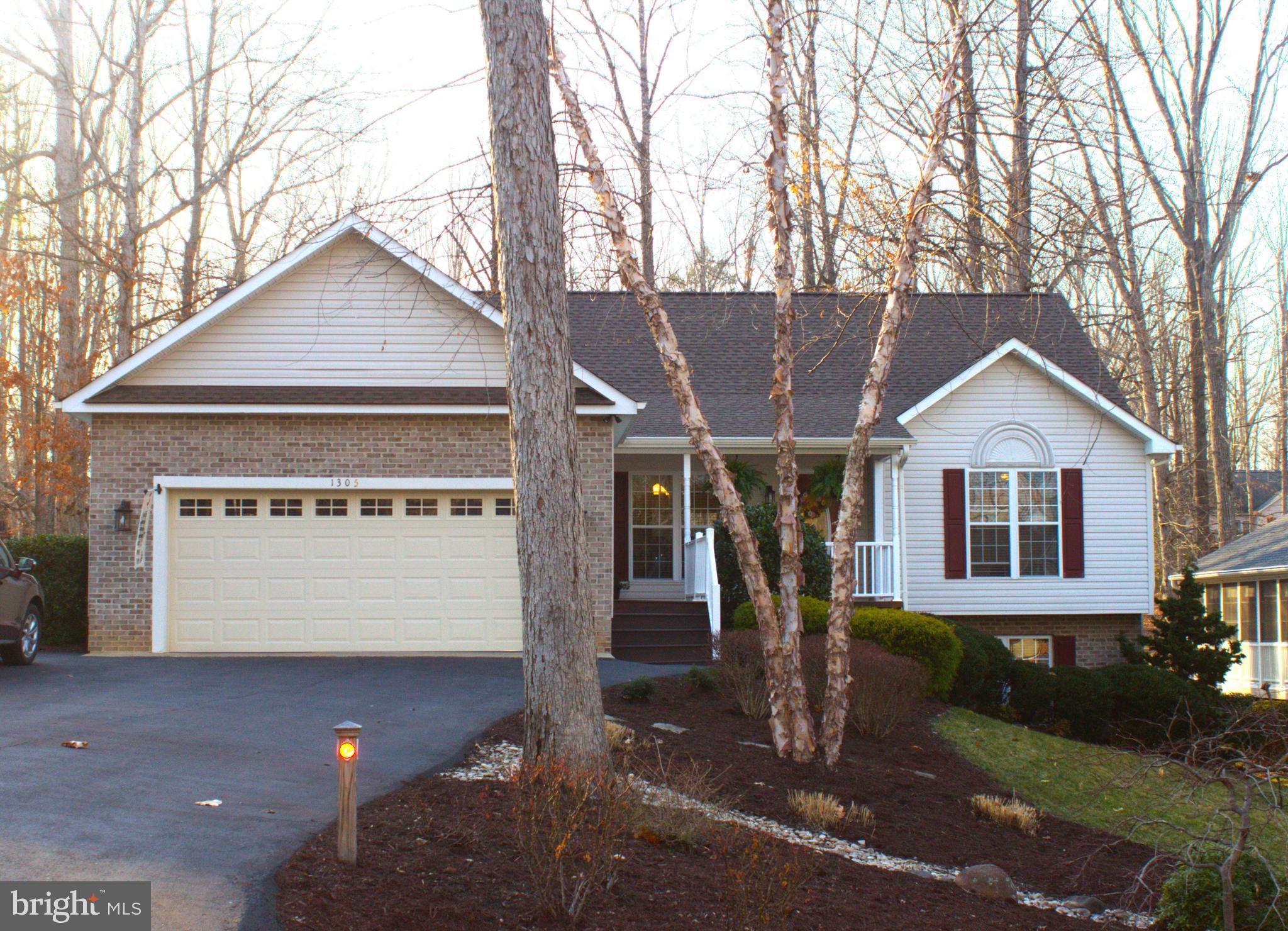 This is a Rare, Charming, Large 3Bd/3bath home adjacent to the 14th tee box on the Lake of the Woods Golf course.   The home has over 3,300 Sq Ft of updated space for you and your family!!  The Master Bedroom has walk in closets, a modern shower, tub and vanity.  The Guest bath has been finished with an exquisite tiled shower.   The kitchen boasts quartz countertops, white cabinetry, and black stainless appliances.   There is a large walk out basement with an office, Rec room with a functioning wood stove, TV Media area, Den and two storage rooms.  The Den has been used as a bedroom by the current owners.  The grounds have been meticulously designed and cared for.  The premium lot backs to the 14th tee, enjoys a partial water view out the front and sits on a cul de sac.  Lake of the Woods provides an abundance of amenities, including two lakes for swimming and boating, community pools, basketball and tennis courts, an equestrian center, a clubhouse, a fitness center, and miles of scenic walking paths. You will not find this much room in most of the homes in the community