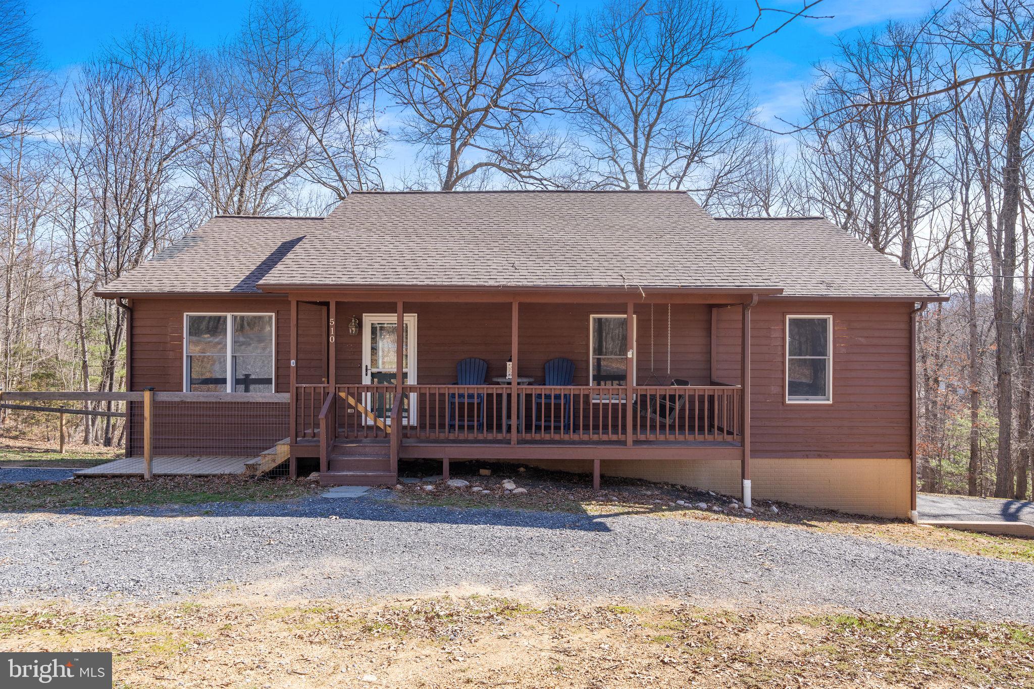 Experience the perfect blend of privacy, comfort, and natural beauty in this stunning 3-bedroom, 2.5-bathroom home, ideally situated on 5 acres in the heart of Front Royal, VA.

As you step inside, you'll be greeted by an inviting open floor plan, accentuated by soaring cathedral ceilings and gleaming hardwood floors. The spacious living area flows seamlessly into the kitchen, offering the perfect space for both everyday living and entertaining.

Down the hall, you'll find three generously sized bedrooms, including a serene primary suite, two additional bedrooms, and a second full bathroom. The convenience of a main-level laundry room adds to the home's functional layout.

The lower level offers a large rec room, perfect for a home theater, game room, or gym, along with a half bath. A two-car garage provides ample storage and parking space.

Outdoor enthusiasts will love the expansive 5-acre lot—perfect for exploring, gardening, or simply enjoying the peace and quiet of nature. Nestled in the picturesque Shenandoah Valley, this home is just minutes from charming downtown Front Royal, offering boutique shopping, local dining, and the famous Skyline Drive. Adventure awaits with easy access to hiking trails, the Shenandoah River, and numerous wineries and breweries.

Don't miss the opportunity to own this private retreat with modern conveniences and breathtaking surroundings—schedule your showing today!