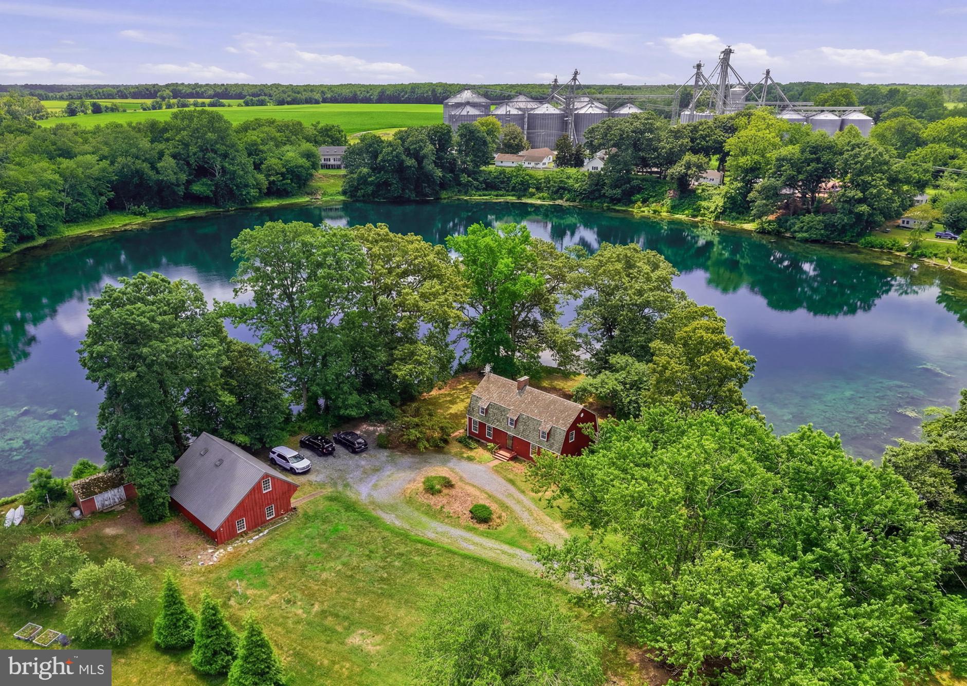 Nestled on a private peninsula jutting into the tranquil waters of the Wye Mills lake, 132 Denny Lake Road in Wye Mills, MD, is a breathtaking Dutch Colonial gem. Boasting over 3000 square feet of living space, with a fully finished walk-out basement adding a fourth bedroom and two and a half baths in total, this home offers spectacular lake views from every level. Outside, the bulk headed shoreline was completed within the last 30 years, ensuring stability and charm.
  Perfectly situated for both tranquility and convenience, this home is centrally located—just 15 minutes to Kent Island or Centreville and only a short drive to Easton. Whether commuting to Annapolis (approx. 30 min)  or exploring the Eastern Shore, you’ll find every destination within easy reach—making this the ideal blend of serenity and accessibility.
  A standout feature is the large detached garage with a workshop and a one-bedroom apartment above, complete with a deck overlooking the water—an idyllic retreat. And with its rare Village Commercial zoning, this property is a standout—offering a special mixed-use designation from Queen Anne’s County. It’s ideal for a home-based business, an Airbnb, or other commercial ventures—a truly one-of-a-kind opportunity to live, work, and play in this iconic setting. 
Cedar roof is about 20 years old w/ a typical life expectance of 40 years. Well and septic were installed in the late 2000's