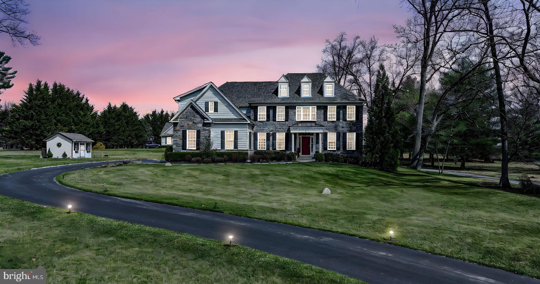 Set on a private 1.07 acre lot, this exceptional home makes a striking first impression from the moment you arrive. It effortlessly blends quality craftsmanship with thoughtful design, while the stone front, long winding driveway, and beautifully landscaped approach create exceptional curb appeal and a truly memorable welcome.
Inside, every detail has been carefully considered, from solid core doors and recessed lighting to custom built closets in every bedroom and a thoughtfully designed pantry. The chef inspired kitchen is beautifully appointed with premium Thermador appliances, a wall mount pot filler, beverage refrigerator, and an oversized island designed for gathering and everyday living. The fireside family room offers warmth and character with a wood burning fireplace, while integrated Sonos sound and smart home features enhance both comfort and convenience.
Upstairs, the primary suite is a true retreat with custom designed dual walk in closets and a spa inspired bath. Four additional bedrooms offer flexibility, including a fifth bedroom that can easily function as a private home office. Custom storage solutions continue throughout, ensuring both style and practicality, while four zone HVAC with smart thermostats provides comfort on every level.
The finished lower level is designed for both relaxation and recreation, featuring a fully equipped home theater with projector and surround sound, a dedicated fitness room, full bath, and expansive open space for entertaining. A large semi finished storage area and a finished workshop add even more versatility and function.
Step outside and discover your own backyard escape, where a resort style saltwater pool with sun shelf and waterfall is complemented by a spacious deck with motorized awning, outdoor sound system, pergola, and beautifully designed outdoor living spaces. Whether hosting gatherings or enjoying a quiet evening, this setting delivers.
Complete with a three car garage with epoxy flooring and electric vehicle outlet, this remarkable property offers a rare combination of luxury, technology, and everyday functionality in one unforgettable setting.