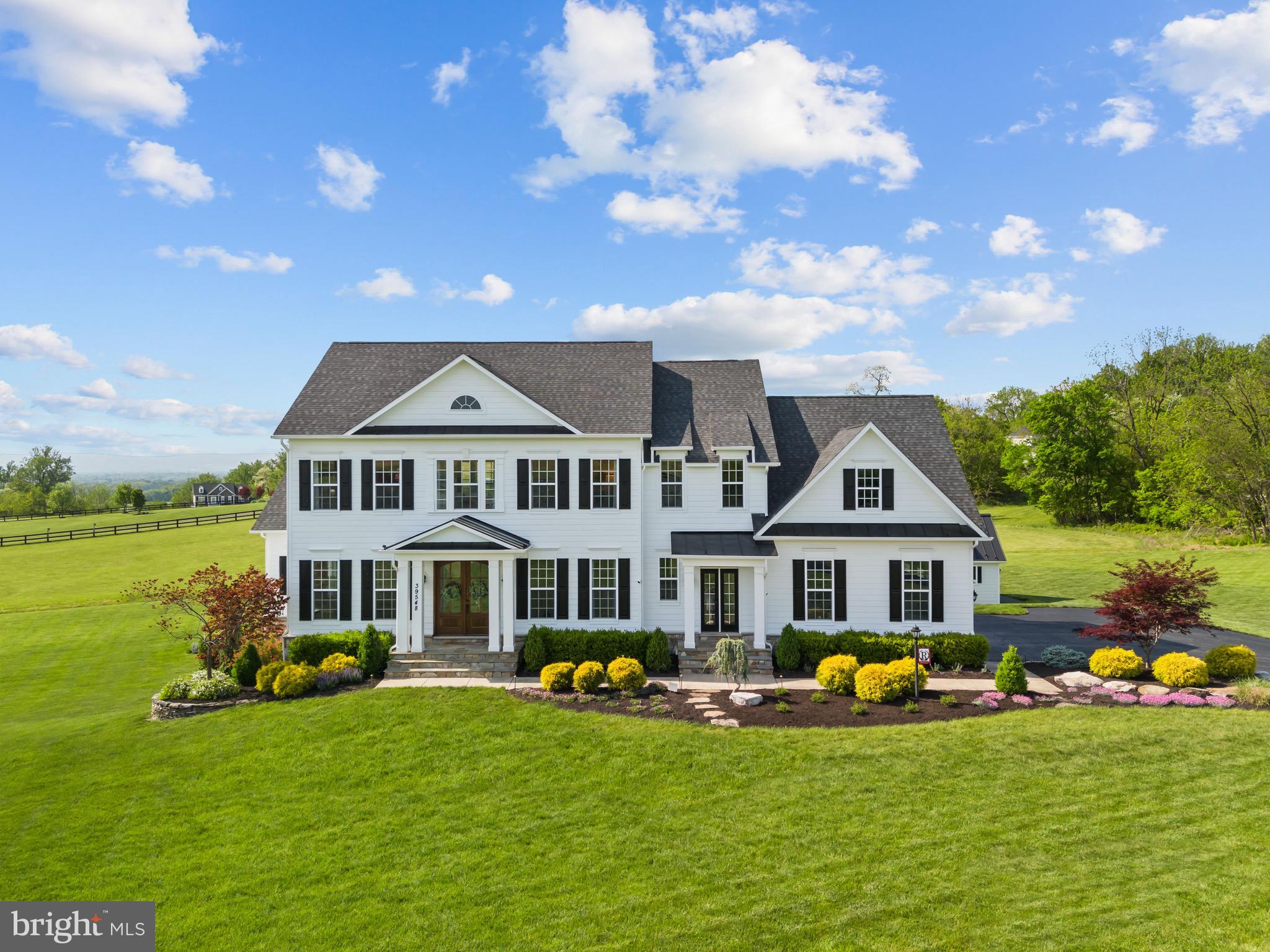 Listed BELOW Appraised Value. Experience luxury in this stunning Leesburg, VA estate, nestled on 6.86 acres with no HOA, this home blends countryside charm with convenient access to shopping, dining, wineries and more. The grand foyer ushers you into a world of sophistication and elegance. The expansive 6,986 sqft layout features a custom kitchen, a private office, and a main level crafted for distinguished living. Upstairs, oversized bedrooms, highlighted by a primary suite with a splendid ensuite bathroom boasting opulent finishes. The fully finished basement offers ultimate entertainment featuring a rec room, two guest bedrooms, a full bathroom, and a kitchenette ideal for hosting. A home theater and gym ensure every moment at home is a luxurious experience. Outside, enjoy breathtaking mountain views, and expansive grounds with endless possibilities for equestrian activities. 250 acres of farmland across the road is in a conservation easement, it will not be developed. This extraordinary home is a rare opportunity to own a piece of luxury where the tranquility of countryside living meets modern convenience.