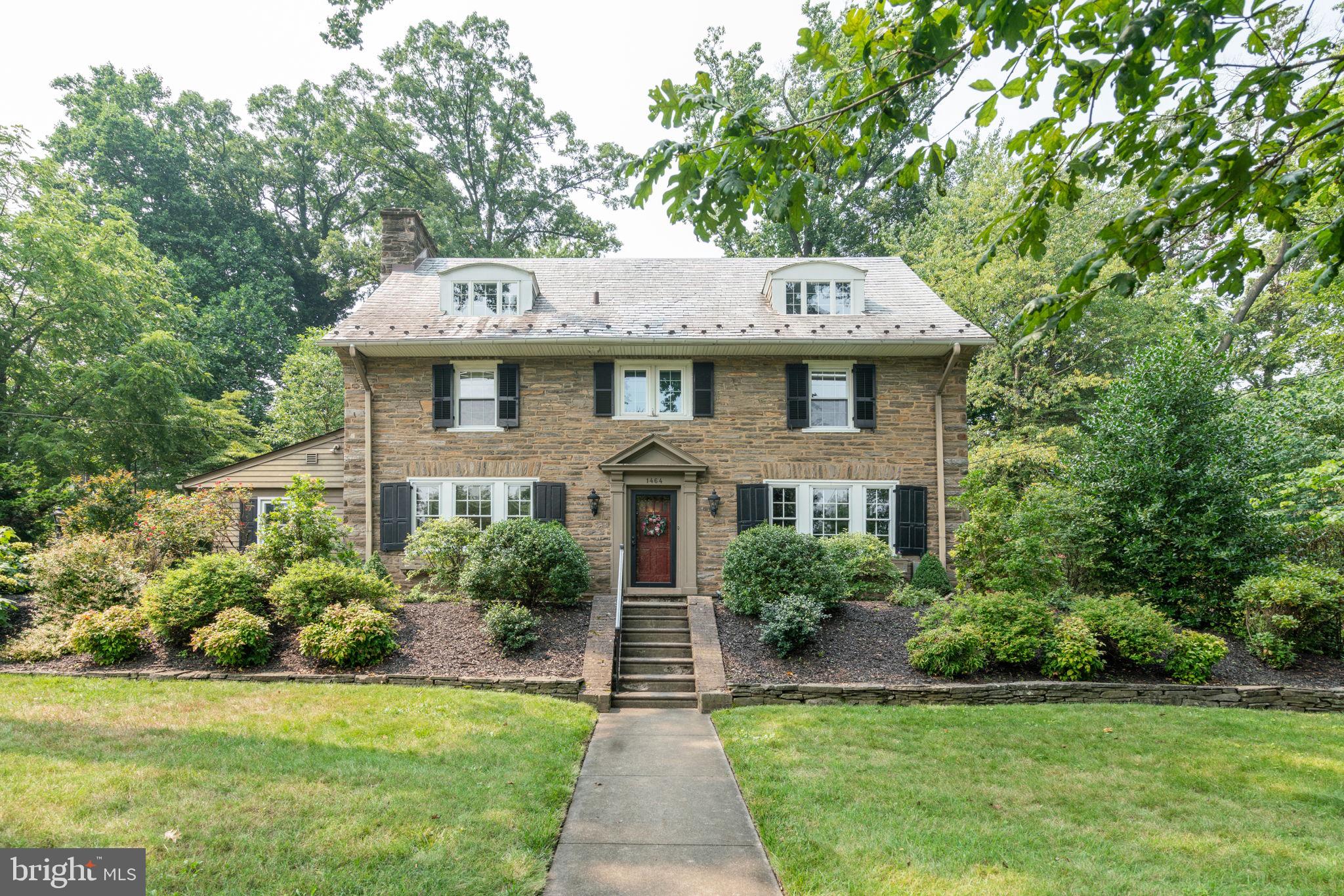 Pride of ownership exudes from this 3-story stone colonial in the highly sought-after Highland Farms neighborhood. In this meticulously cared for home, you’ll find old world charm with a new feel. Enter the large foyer, and to the left is the sizable living room with a wood-burning fireplace and built-ins. Providing an easy flow, French doors on either side of the fireplace lead to a light-filled sunroom/family room that features a skylight, vaulted ceiling, and access to a tiled-floor mudroom leading to the back patio. To accommodate large gatherings or holiday dinners, the formal dining room offers that desired space. Additional prep space and storage can be found in the butler’s pantry, which separates the dining room and kitchen and features an original floor-to-ceiling built-in as well as a double-doored pantry with custom shelving. The cozy eat-in kitchen has plenty of neutral cabinetry and access to the back patio. An updated powder room completes the first floor.
Up the recently refinished hardwood staircase, you’ll find the roomy master bedroom with three closets and two additional bright bedrooms. The second-floor bathroom is newly renovated with marble floor and vanity, crown molding, and chrome fixtures. The second floor also offers a dream laundry room that is spacious and light-filled with built-in cabinetry and stainless steel laundry sink with sea glass countertop.
Ascending to the airy third level, you will find a bedroom equivalent to the master, a room currently used as an office, and another renovated bathroom with a white subway-tiled shower with bench seat, pedestal sink, built-in storage, and radiant heat floor. A large hall storage closet as well as a storage room complete this level, which could become a full master suite.  
Outside, from your expansive flagstone patio, you can admire your own private backyard oasis with stone retaining walls, mature landscaping, and blue stone steps.
The detached 2-car garage has all new siding, windows, garage door, and exterior lights. 
The unfinished basement includes a laundry sink, updated water heater, sump pump with water-powered back-up, and 200-amp electric service.
In the award-winning Abington school district, this home is two blocks from Highland Elementary and conveniently located within easy walking distance to Abington Jefferson hospital, shopping, and restaurants and easily accessible to 611, the turnpike, and multiple regional rail stations.