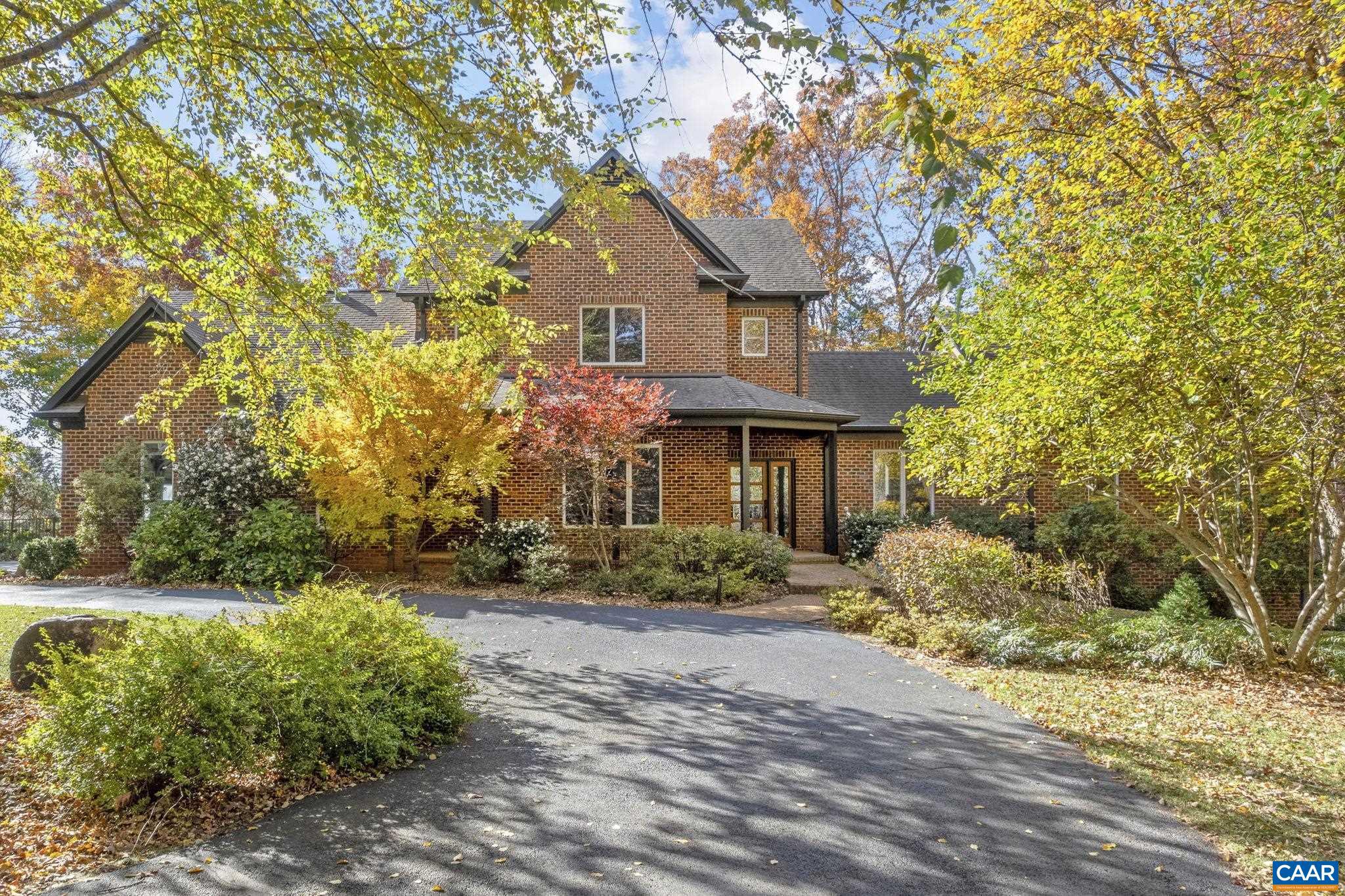 OPEN HOUSE SUN 1/11 1-3PM. This completely renovated home sits on 2 acres very convenient to Charlottesville. With clean architectural lines, large windows, and designed living spaces, this home showcases meticulous craftsmanship throughout. The open concept main living area features a chef's kitchen with granite counters, a a spacious island, and top of the line appliances, flowing naturally into a bright dining area and cozy family room. Also on the main level, the primary suite provides a peaceful retreat with vaulted ceilings, a walk in closet with custom built ins, and a luxurious en suite bath adorned with marble plus dual vanities and oversized shower. Three additional bedrooms upstairs and two beautifully appointed baths. The "bunk" room is great for guests of all ages. Downstairs offers additional living space, office, or craft space, and a guest bedroom suite. Enjoy great outdoor living spaces including a vaulted screened porch with wood ceiling opening to the deck overlooking the fabulous landscaped yard.,Granite Counter,Marble Counter,White Cabinets,Fireplace in Family Room
