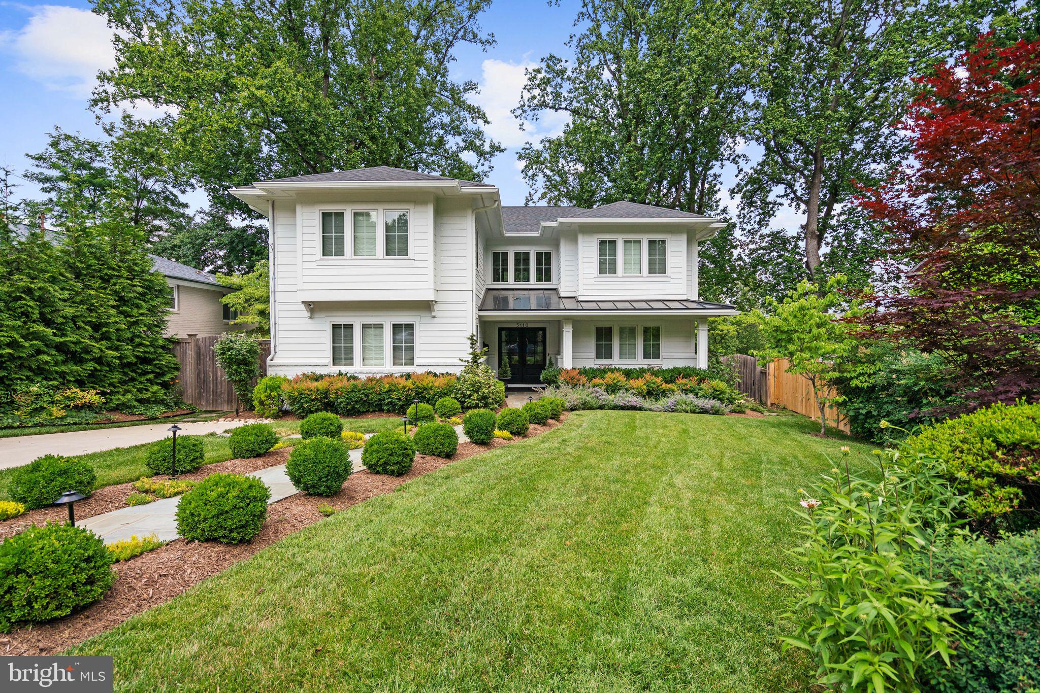 Better than new, this exceptional custom-built six-bedroom home in the Westbrook Neighborhood checks every box without feeling like it tried. Planned and developed from the ground up, it provides more than 4,650 square feet of generous living spaces. Thoughtfully curated interiors with impeccable craftsmanship, every finish has already been chosen, every decision has already been made. All that's left is to move in and begin living.

Hints of the incredible attention to detail is felt the moment you pull up. The crisp facade is bright and cheery, highlighted by professionally landscaped lawn, flowering plantings, and a stone approach. Once inside, the home unfolds naturally, with nine-foot ceilings and oversized windows pulling sunlight deep into the interiors. Traditional and open at the same tone, the beautifully proportioned rooms create a sense of calm that never goes out of style.

The formal living and dining rooms are elegant without feeling stuffy; anchored by a fireplace and connected by easy sight lines that encourage conversation rather than ceremony.

At the center of the home, the kitchen does exactly what the best kitchens do: bringing everyone together. Open to the breakfast area and spacious family room, it was designed for weeknight dinners that stretch longer than expected, and friends who always seem to gather around the island. Thoughtfully selected finishes – custom wallpaper, artisan tile, layered lighting, beautiful fixtures, and timeless materials – quietly elevate the everyday without ever demanding attention.

Just beyond, walls disappear. The screened porch opens to an expansive deck overlooking the private backyard and distant city views, while the lower patio creates another destination entirely. Morning coffee, grilled hot dogs, and s'mores all taste better here since this backyard becomes another room of the house.

A main-floor bedroom/office, along with a full bath, completes the main level.

Upstairs are four large bedrooms, including the primary suite that is expansive and sumptuous. Delivering everything an owner's retreat should, it includes a private balcony that welcomes the morning, ample closet spaces, and a beautifully finished six-piece en suite bath make everyday routines feel anything but ordinary. Three additional bedrooms offer flexibility for any modern-day need – bedrooms, extra office, or guest spaces. A thoughtfully designed hall bath and attic access keeps the home humming along.

And the walk-out lower level? Score! It includes an expansive recreation room that easily transforms from movie nights to rainy Saturday play space, while a sixth bedroom, full bath, bonus room, laundry, and exceptional storage provide the flexibility every household needs.

This gorgeous home is sited on a uniquely private lot with treetop views in the Westbrook Neighborhood. Generations of residents have fallen in love with tree-lined streets, neighborhood traditions, and an easy sense of community. Stroll to Millie's for dinner. Pick up steaks from Wagshal's. Meet friends at Compass Coffee. Steps to the Capital Crescent Trail and the Friendship Heights Metro, the home oozes urban convenience with a suburban feel. Westbrook Elementary, Westland Middle, and B-CC High School serve the neighborhood. Quick access to Downtown Bethesda, Walter Reed, NIH, and major commuter routes makes life here not just beautiful, but easy.