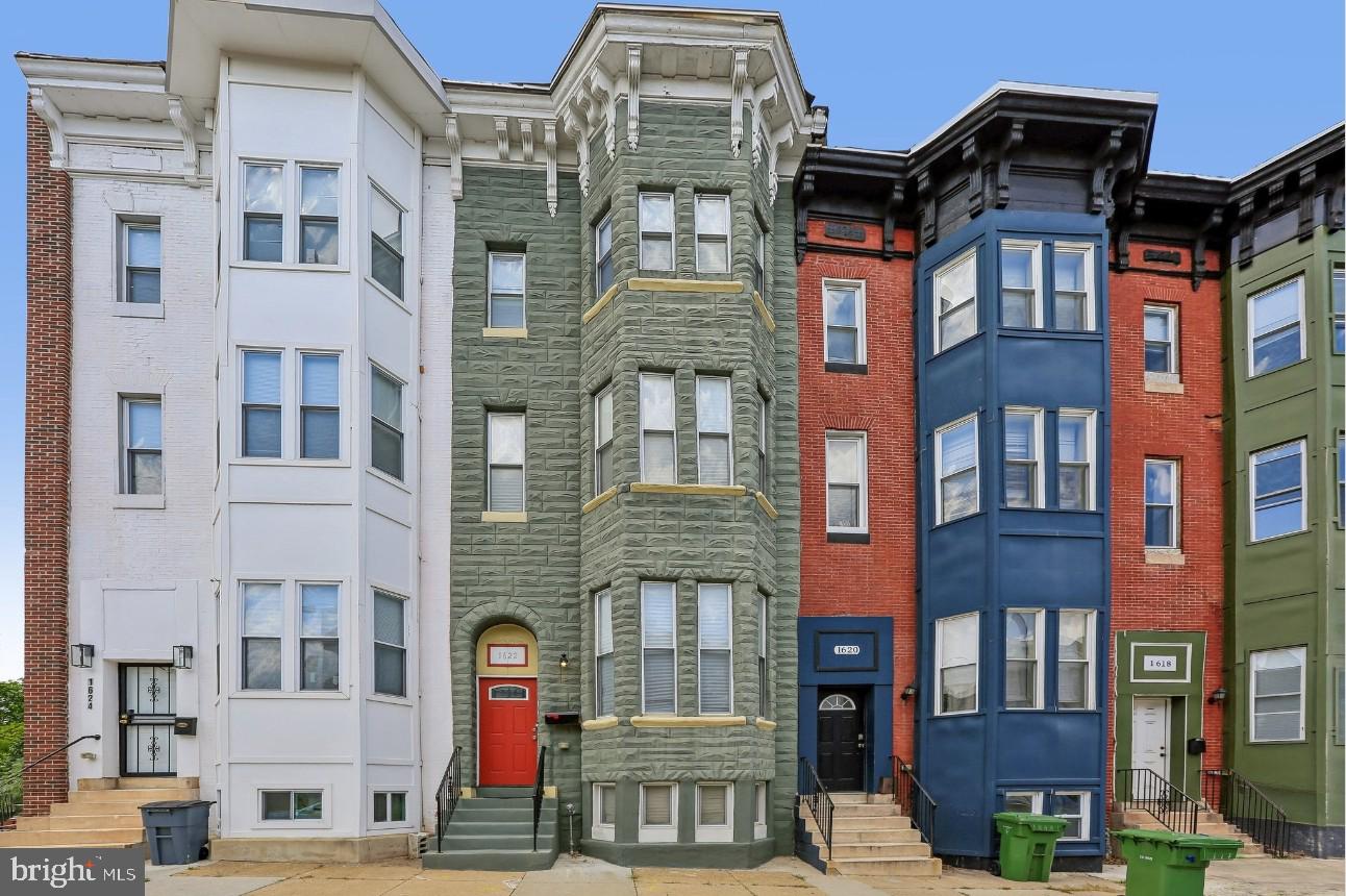 Step into a rare blend of historic charm and modern sophistication in this stunning brick-front, four-level townhome, thoughtfully renovated while preserving its timeless character. Originally built in 1920 and once showcased as the builder’s model home, this exceptional residence reflects distinctive craftsmanship, elegant architectural details, and an unmatched sense of style. Featuring hardwood floors throughout, central air, and beautifully updated living spaces, this home perfectly balances classic character with modern convenience.

The spacious kitchen opens to an expansive private deck, ideal for entertaining or relaxing, complete with a covered sitting area below for additional outdoor enjoyment. Recent upgrades include a new LG refrigerator (2024), new dishwasher, washer and dryer, plus an ADT camera and security system for added peace of mind. The finished basement with egress door offers flexible additional living space perfect for a recreation room, guest suite, gym, or home office. Outside, enjoy the convenience of private fenced parking with a manual lock gate.

From the striking curb appeal to the carefully curated renovations throughout, every detail creates a warm yet elevated living experience. Ideally located just minutes from area hospitals, downtown Inner Harbor, Ravens and Orioles stadiums, and only approximately 6 minutes to I-295/BW Parkway and I-95 South, this home offers exceptional convenience for commuters and city living alike. Ideally suited for those seeking character, space, functionality, and modern comfort in one extraordinary home. Schedule your tour today!
