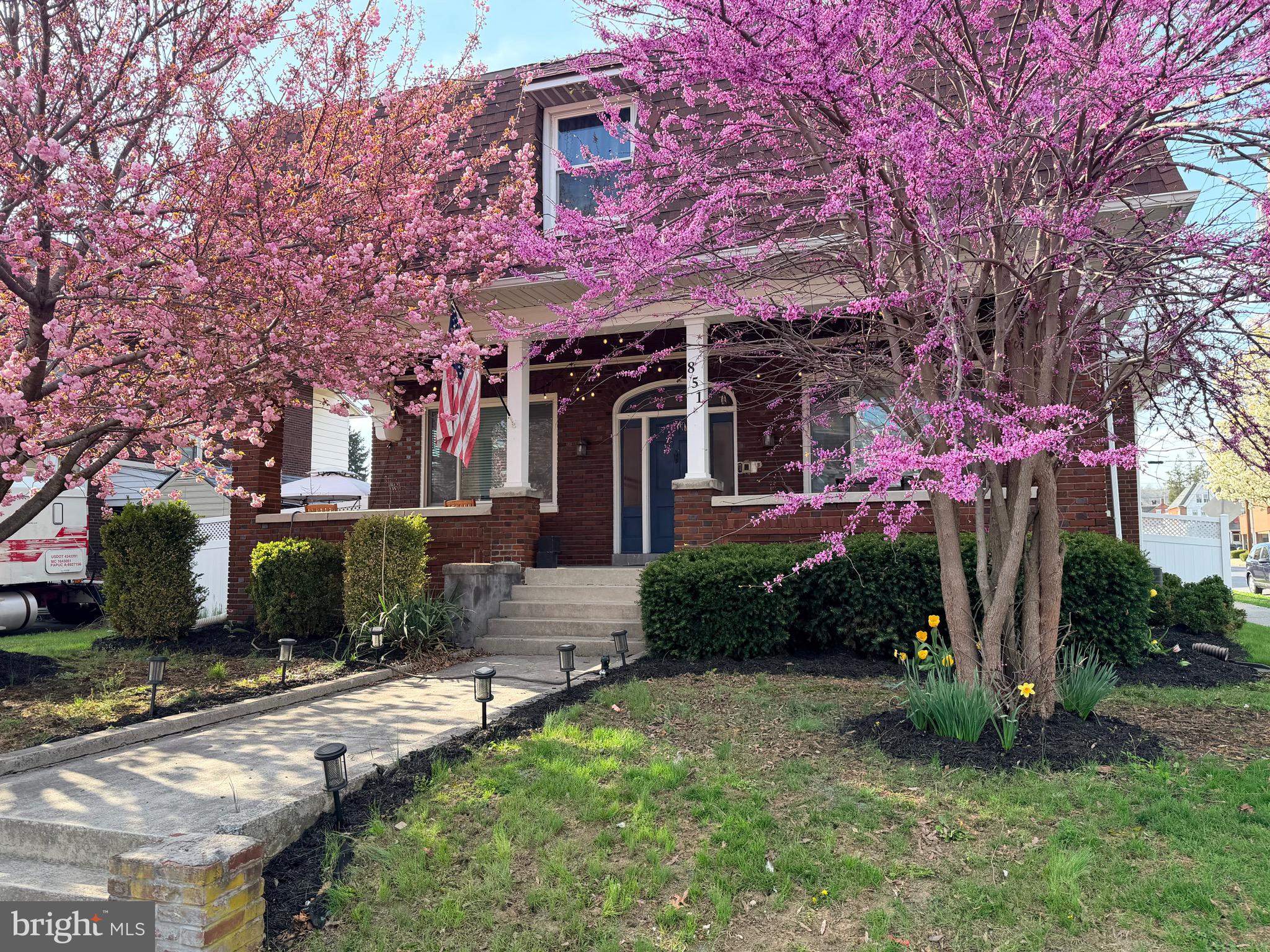 Welcome to this charming Craftsman-style brick home in Columbia Borough. A welcoming front porch sets the stage for this spacious home featuring five bedrooms, two full and one half baths.
Inside, you’ll find original hardwood floors throughout the first floor, an updated kitchen with granite countertops, tile backsplash, and stainless steel appliances, plus beautiful glass-paneled French doors that add character and charm. The front office features a decorative fireplace, while large windows fill the home with natural light.
The second-floor primary suite offers a private retreat with its own full bath, walk-in closet and sliding doors leading to a private balcony. The additional bedrooms are generously sized and provide flexibility for family, guests, or a home office. Enjoy the convenience of a second floor laundry room within the large main hallway bathroom.  Ample closet space and storage throughout the home add to its functionality.
Outside, enjoy the fully fenced backyard and detached two-car garage. Offering a blend of timeless character and modern updates, this home is ready for its next chapter.