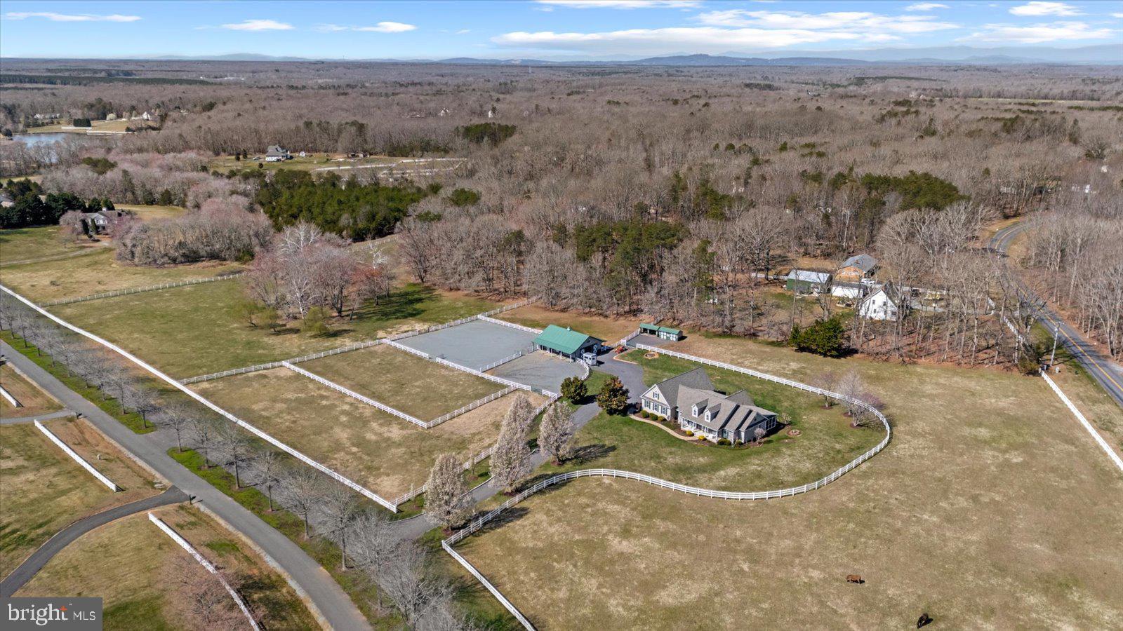 If horses could house-hunt, they’d circle this one and never leave.

Set on nearly 11.5 acres of thoughtfully designed equestrian paradise, this property doesn’t just check boxes—it spoils both horse and rider in equal measure. From the moment you arrive, the setting feels like a deep exhale… peaceful, private, and perfectly tailored for a life where mornings begin with soft nickers and end with golden sunsets over open pasture.

The barn? It’s not just a barn—it is impressive space! A beautifully crafted 36x48 Morton barn (color-matched to the home for a seamless estate feel).  It’s a five-star equine retreat.  It features five spacious 12x12 stalls with rubber mats, dual access doors, and Dutch doors that let your horses greet the day on their own terms. Ceiling fans in each stall keep things cool and comfortable, while a dedicated wash stall, feed room, and tack room make daily routines effortless. Water access at both ends, multiple turnout options, dry lots, and a 100x200 grass ring mean your horses live their very best lives… honestly, better than most people.

And speaking of people… you’re not exactly roughing it here.

With over 3,300 square feet, the home welcomes you with a spacious, beautiful open kitchen and family room floor plan that was made for gathering. Cozy up by the fireplace on crisp evenings or start your day in the sunlit eat-in kitchen, where your morning coffee comes with front-row views of horses grazing in the pasture. When it’s time to host, the formal dining room and elegant living room rise to the occasion—perfect for holidays, celebrations, and those “let’s just invite everyone” kind of nights.

The owner’s retreat is exactly that—a retreat. A grand-sized main bedroom with generous closets and a stunning bath creates a private haven to unwind and recharge. Additional bedrooms warmly welcome guests who may arrive for a weekend… and start wondering if they should stay longer, because it truly feels like a horse estate tucked somewhere out in Wyoming.

Upstairs, the bonus space is the ultimate wildcard—in the best way. A large loft with a full bath offers endless possibilities: crafting studio, home office, media lounge, or the coveted “hideaway” space everyone secretly wants. It could even serve beautifully as a second-generation suite.

Step outside and this is where the lifestyle truly shines.

A top-of-the-line Trex deck (partially covered for year-round enjoyment), screened porch, and covered patio create the ultimate outdoor living experience. Picture yourself here: mornings wrapped in quiet, afternoons watching your horses canter by, and evenings soaking in the fabulous hot tub as the sky melts into sunset. Breathe it in… this is what space, freedom, and a little bit of magic feel like.

Practicality hasn’t been overlooked either. A 25’ x 29’ oversized garage, driveway alarm, Ring doorbell, 500-gallon propane tank (tastefully landscaped), and meticulously maintained systems—from well and septic to HVAC and more—mean peace of mind comes built in. Even the extras shine, with multiple run-ins, storage sheds, solar flood lights, and vinyl fencing already in place.

It’s rare to find a property where the lifestyle feels this complete—where luxury meets land, and function meets freedom.

Here, the horses are happy.
The sunsets are unforgettable.
And life… feels exactly the way it should.