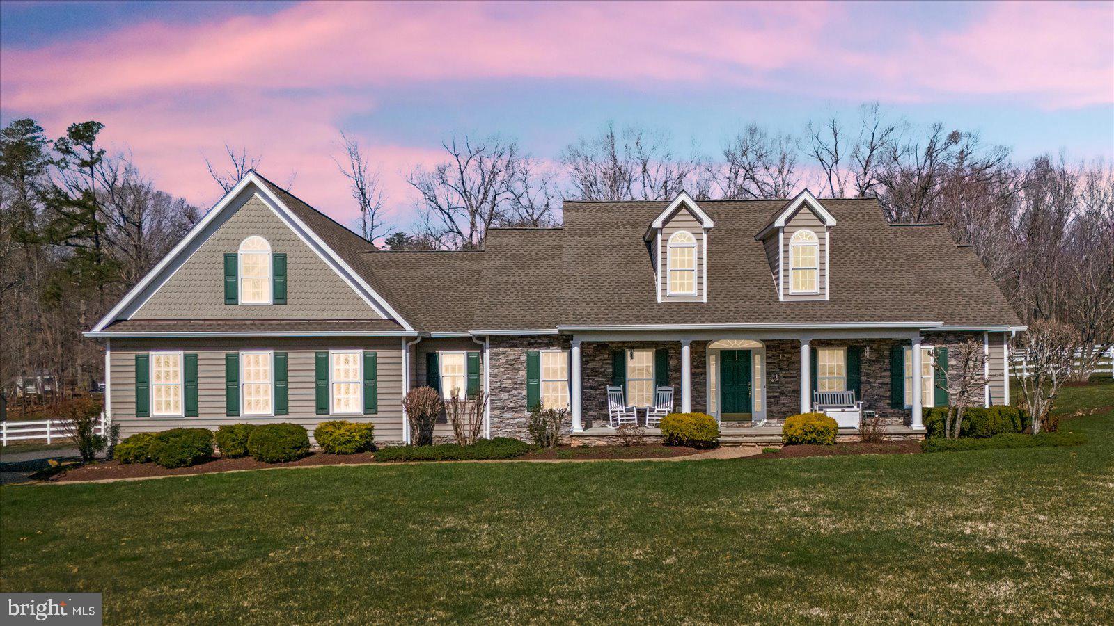 If horses could house-hunt, they’d circle this one and never leave.

Set on nearly 11.5 acres of thoughtfully designed equestrian paradise, this property doesn’t just check boxes—it spoils both horse and rider in equal measure. From the moment you arrive, the setting feels like a deep exhale… peaceful, private, and perfectly tailored for a life where mornings begin with soft nickers and end with golden sunsets over open pasture.

The barn? It’s not just a barn—it is impressive space! A beautifully crafted 36x48 Morton barn (color-matched to the home for a seamless estate feel).  It’s a five-star equine retreat.  It features five spacious 12x12 stalls with rubber mats, dual access doors, and Dutch doors that let your horses greet the day on their own terms. Ceiling fans in each stall keep things cool and comfortable, while a dedicated wash stall, feed room, and tack room make daily routines effortless. Water access at both ends, multiple turnout options, dry lots, and a 100x200 grass ring mean your horses live their very best lives… honestly, better than most people.

And speaking of people… you’re not exactly roughing it here.

With over 3,300 square feet, the home welcomes you with a spacious, beautiful open kitchen and family room floor plan that was made for gathering. Cozy up by the fireplace on crisp evenings or start your day in the sunlit eat-in kitchen, where your morning coffee comes with front-row views of horses grazing in the pasture. When it’s time to host, the formal dining room and elegant living room rise to the occasion—perfect for holidays, celebrations, and those “let’s just invite everyone” kind of nights.

The owner’s retreat is exactly that—a retreat. A grand-sized main bedroom with generous closets and a stunning bath creates a private haven to unwind and recharge. Additional bedrooms warmly welcome guests who may arrive for a weekend… and start wondering if they should stay longer, because it truly feels like a horse estate tucked somewhere out in Wyoming.

Upstairs, the bonus space is the ultimate wildcard—in the best way. A large loft with a full bath offers endless possibilities: crafting studio, home office, media lounge, or the coveted “hideaway” space everyone secretly wants. It could even serve beautifully as a second-generation suite.

Step outside and this is where the lifestyle truly shines.

A top-of-the-line Trex deck (partially covered for year-round enjoyment), screened porch, and covered patio create the ultimate outdoor living experience. Picture yourself here: mornings wrapped in quiet, afternoons watching your horses canter by, and evenings soaking in the fabulous hot tub as the sky melts into sunset. Breathe it in… this is what space, freedom, and a little bit of magic feel like.

Practicality hasn’t been overlooked either. A 25’ x 29’ oversized garage, driveway alarm, Ring doorbell, 500-gallon propane tank (tastefully landscaped), and meticulously maintained systems—from well and septic to HVAC and more—mean peace of mind comes built in. Even the extras shine, with multiple run-ins, storage sheds, solar flood lights, and vinyl fencing already in place.

It’s rare to find a property where the lifestyle feels this complete—where luxury meets land, and function meets freedom.

Here, the horses are happy.
The sunsets are unforgettable.
And life… feels exactly the way it should.