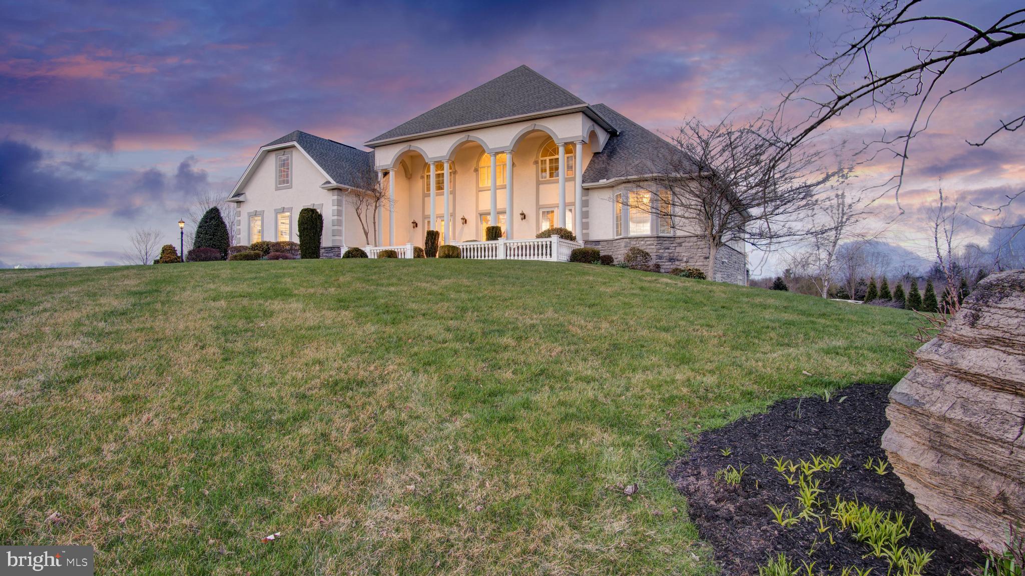 Prepare to be amazed! This luxury estate located in within minutes of UPMC Carlisle Regional Medical Center is absolutely teeming with custom features and over the top luxury touches. This property stands out among the crowd as truly unique and truly opulent. * Massive chef's kitchen complete with six burner gas range, oversized Frigidaire refrigerator, top and bottom convection wall ovens, three goose neck stainless steel sinks, granite countertops,  high powered hood vent and soft close custom cabinets. * Wet bar in kitchen with stemware racks, glassware storage cabinet, wine refrigerator and Culligan water filtered water tap. * First floor owner's suite complete with gas fireplace, home office space, bedroom lounge area, patio access and lots of natural light. * Owner's bathroom includes two walk in closets with built- in closet systems, ceramic tile floor, large jacuzzi tub with chandelier, large tile shower stall, two full vanities, and a water closet. *Downstairs washer and dryer in mudroom * Walk in pantry * Foyer features checkerboard marble tile, a custom curved statement staircase with wrought iron spindles, large columns, center chandelier with retractable cable system for easy cleaning and decorating, formal living room, formal dining room, and tons of natural light from the three glass double doors facing West. * Living room features newly refinished hardwood floors, gas fireplace, 18 foot ceilings with views of the catwalk on the second flooring and patio access from two double doors. * Upstairs features four bedrooms each with a walk-in closet, two full bathrooms, and upstairs laundry room. * Fully finished basement is overloaded with features including an in home movie theater, fully equipped wine cellar, large kitchenette, downstairs living room, and large bedroom with ensuite full bathroom. * Outdoor living area includes covered patio with three fans, spiral staircase for upstairs access, newer paver patio, outdoor kitchen, gas fire pit with glass stones, hot tub, and tiered garden beds for the green thumb. * 3 car oversized garage * Whole house generator * 1.47 acre corner lot * Don't let this truly one of a kind home pass you by. Call to schedule your private showing today!