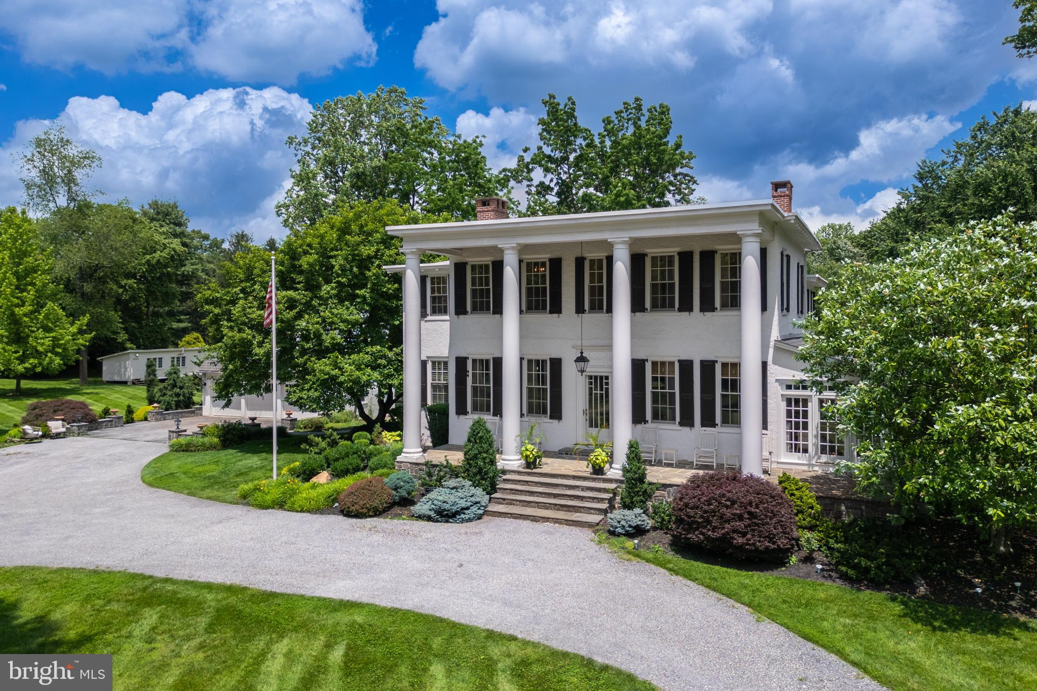 Beautiful, impeccable, completely restored and modernized estate home with jaw dropping appeal situated on 5.3 acres+ of complete serenity. This unique property includes 3.3 flat usable acres with the main house, plus an additional 1.9-acre parcel that you could build on or sell as land via proper approvals. Winner of the West Whiteland Award in 2014, there is nothing like this property in West Chester, offering stunning resort grounds, history, modern living, public water and sewer and location all in one! With a modernized and updated kitchen, this 5 bedroom, 3.5 bath home includes a detached in-law suite above the garage which adds 1 more bedroom plus a full bathroom, kitchen, and lounge area - perfect for family visiting, or it can be utilized as a very rentable space! The long wrap around driveway creates a stately grand entrance featuring a huge covered front porch and large pillars. Inside, the list of distinctive features is seemingly endless with a grand foyer entrance, gleaming, spotless hardwood floors, beautiful crown molding, wainscoting, 9-inch baseboards throughout the entire home, 2 marble gas fireplaces, beautiful built-ins, Pella windows throughout, upgraded electric and plumbing, and state-of-the art appliances including a newly added ice machine. A sunroom addition with floor to ceiling windows is a true retreat with fabulous views, and you can step out to the side slate patio where the grounds include a new firepit, 2 golf greens and unprecedented resort living. What a rare gem to find such a sophisticated retreat that is still so close to everything! 1 mile from Rte 202 and Rte 100, a few miles from the turnpike or downtown West Chester! Dating back to the early 1800’s, this home was used as the former Anne Cressons Boarding School for Girls, and has had only 4 owners in the last 100 years. This is a unique opportunity to become the next steward of a very special place. A home that truly deserves a personal visit – request your appointment today!