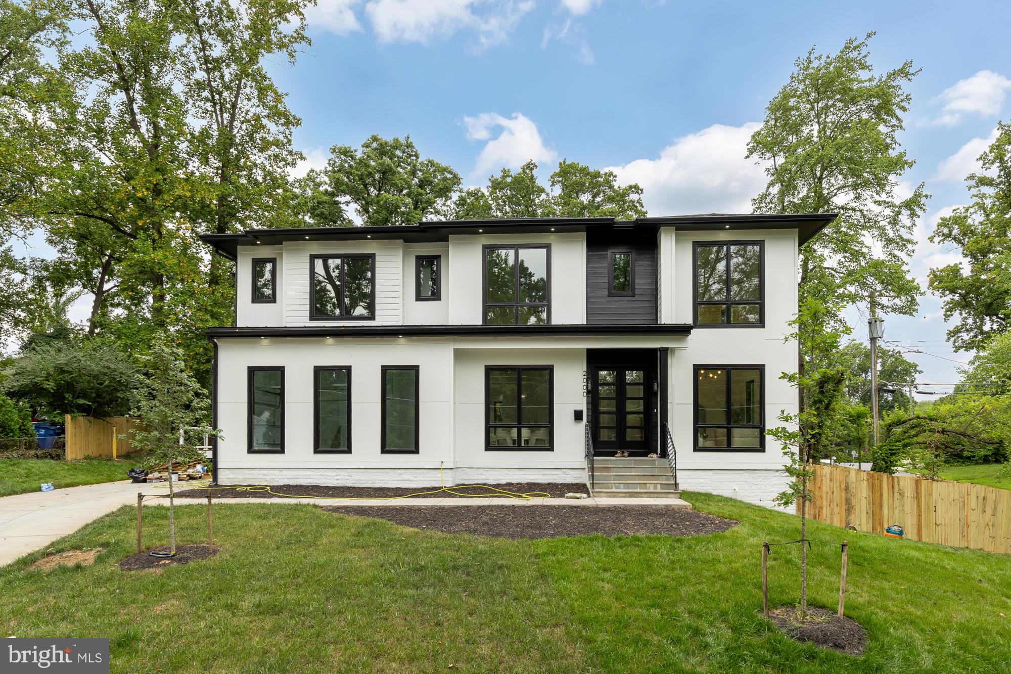 Welcome to 2000 Oswald Place, built by SSB Homes, an exceptional custom residence offering approximately 6,800 square feet of thoughtfully designed living space across three finished levels. With six bedrooms, six full bathrooms, and two half baths, this home seamlessly blends timeless architecture with modern luxury.

Double glass entry doors welcome you into elegant formal living and dining rooms, where soaring ceilings, 8-foot solid-core doors, and abundant natural light create an atmosphere of understated elegance. At the heart of the home is a showpiece chef's kitchen featuring stacked custom cabinetry, a 48-inch JennAir professional refrigerator, a six-burner JennAir gas range, an oversized center island, and premium finishes designed for both everyday living and effortless entertaining. The kitchen flows seamlessly into the expansive family room, highlighted by a striking floor-to-ceiling electric fireplace with designer feature walls, while sliding glass doors open to the rear deck for effortless indoor-outdoor living. The main level also features a private guest suite with a full en-suite bath, offering exceptional flexibility for visitors or multigenerational living.  The home is also fitted for an elevator.

Upstairs, a spacious landing provides the perfect secondary lounge, reading nook, or flex space. The luxurious primary suite serves as a private retreat with dual walk-in closets and a spa-inspired bath featuring an oversized frameless glass shower, dual vanities, designer gold fixtures, and elegant tilework. Four additional generously sized bedrooms, well-appointed bathrooms, and a conveniently located laundry room complete the upper level.

Designed for entertaining, the finished lower level features an expansive recreation room, a custom wet bar with extensive cabinetry, quartz countertops, floating shelves, and a sink, a dedicated theater room, an additional bedroom and full bath, plus generous unfinished storage with endless possibilities for future customization.

Completing the home is a three-car garage, abundant storage throughout, and a highly functional floor plan that effortlessly balances grand entertaining spaces with comfortable everyday living. Offering approximately 6,800 square feet of refined living space, 2000 Oswald Place is a rare opportunity to own a beautifully crafted residence designed with exceptional quality, luxury, and functionality in mind.