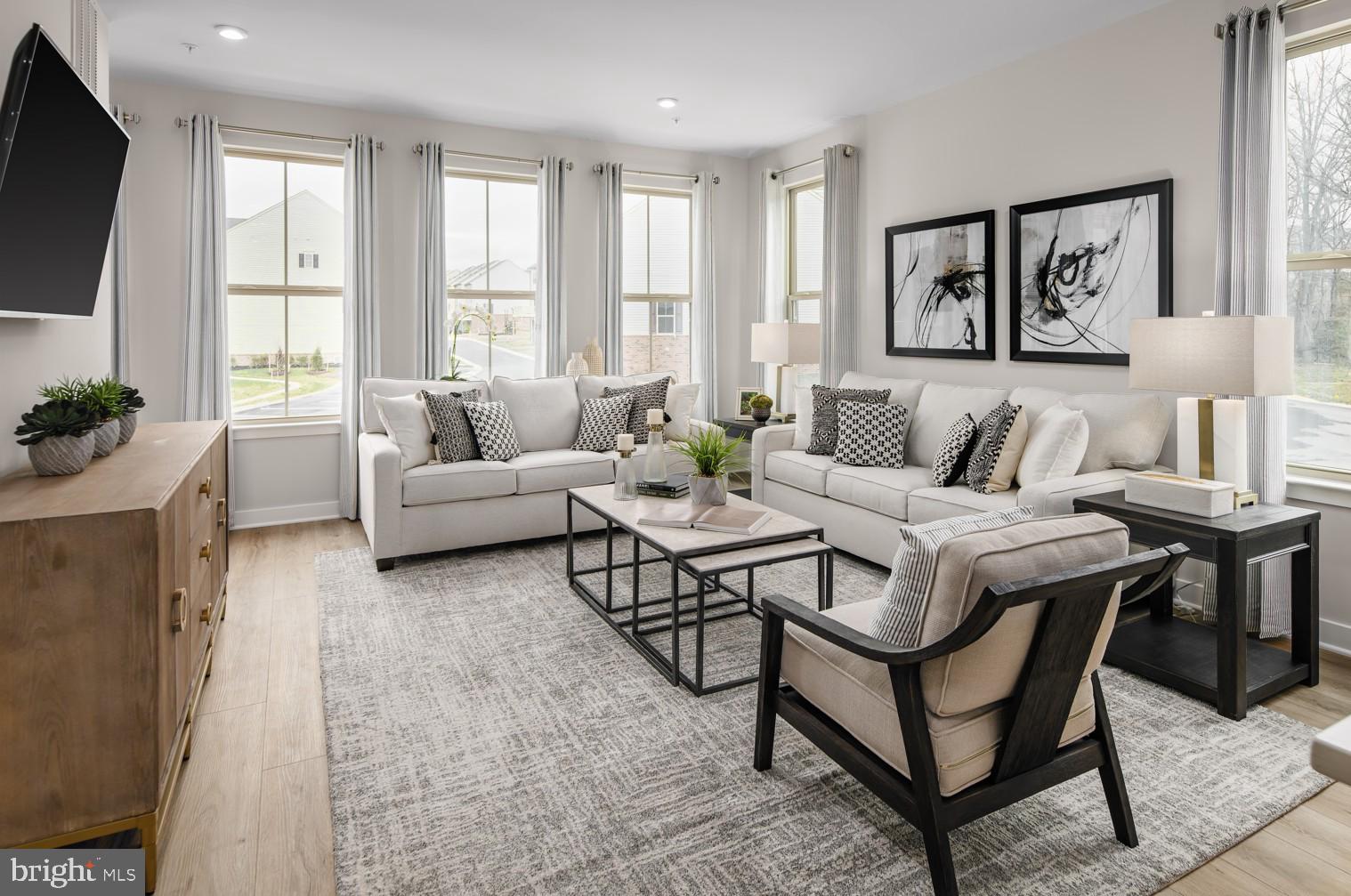 Welcome to the To-Be-Built CADENCE Floorplan at the brand new MADISON GREENS community in Ranson, WV! Luxury townhomes that live like a single family home with backyards and a prime location walkable to Potomac Towne Center and right off Rt. 9. Only 20 min from Frederick County, MD and 30 min from Loudoun County, VA. Step through the welcoming foyer into an expansive recreation room, perfect for entertaining or relaxing. Want even more flexibility? Add a full bath to transform this space into a private guest suite. On the main level, experience true open-concept living. The spacious great room flows seamlessly into a gourmet kitchen featuring a large center island, walk-in pantry, and adjoining dining area — ideal for gatherings and everyday life. Upstairs, discover two secondary bedrooms and a full bath, along with your luxurious owner’s suite. Enjoy the convenience of two walk-in closets and a spa-inspired bath with dual vanities. Come visit our model home at: 1741 Destrier St, Ranson, WV, 25438