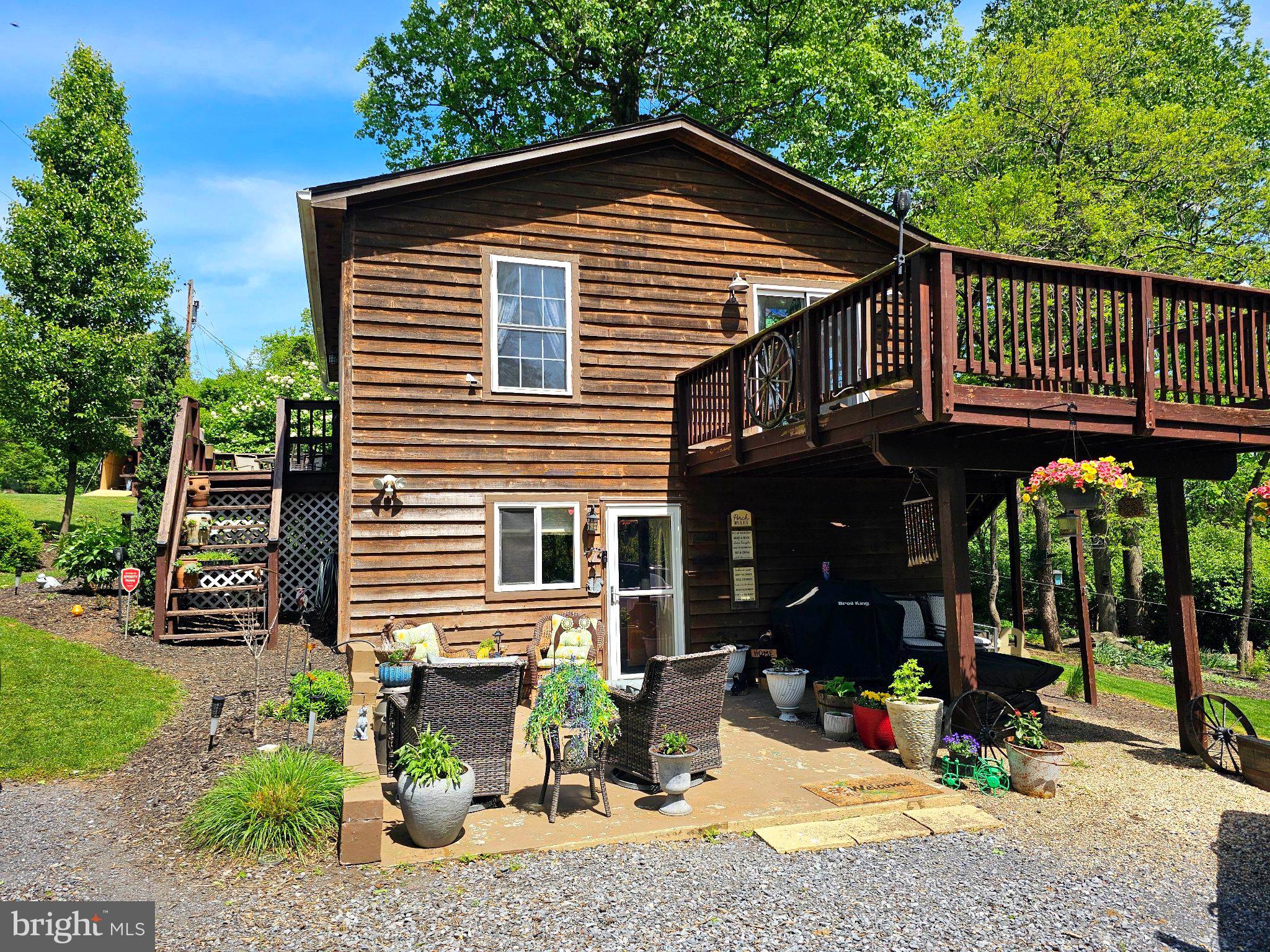 Nestled in the serene Skyland Estates, this charming raised ranch offers a perfect blend of comfort and style. With roof replacement in 2020, Champion Electric Start Whole House Generator installed 2022, Washing Machine replaced in 2024, Dishwasher replaced 2023, Gutter replacement 2025, Deck repairs May 2026,  the home boasts an excellent condition, ready for you to move in and make it your own. Step inside to discover a warm and inviting interior featuring exposed beams in the kitchen and a combination kitchen/dining area that encourages gatherings and shared meals. The galley kitchen is equipped with modern appliances, including a dishwasher, electric oven/range, and an extra refrigerator/freezer, making meal prep a breeze. The entry-level office/den provides convenience, while the luxury vinyl plank, ceramic tile flooring and carpet add a touch of elegance throughout. Outside, the property sits on a generous 0.23-acre corner lot, offering a meticulous landscape with beautiful gardens and mature trees. Enjoy peaceful moments on the deck or patio, perfect for outdoor entertaining or simply soaking in the tranquil surroundings. Additional features include a shed for extra storage and a circular gravel driveway that provides ample parking. With stunning views of the garden, mountains, and woods, this home is a true retreat. Located just minutes from commuter lots, it combines the best of suburban living with easy access to nearby amenities. Experience the comfort and charm of this delightful home, where every detail has been thoughtfully designed for your enjoyment.