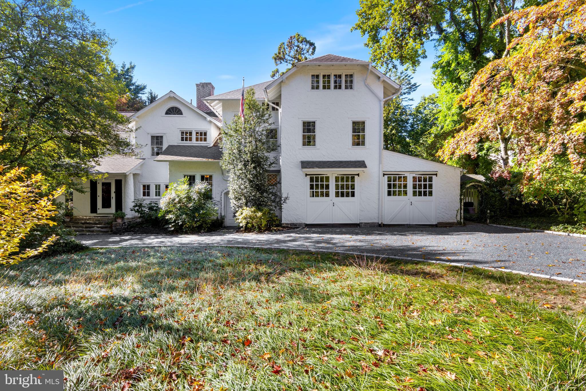 Lyncroft is crafted in the style of a California Craftsman yet finished in a more conservative east-coast style. James Renwick Kerr and his wife Anne Rulon Wetherill Kerr were the first owners of the home, constructed in 1905. Anne’s father started one of the largest engine manufacturing companies in 1871 called Robert Wetherill & Co. Their specialty was the Corliss steam engine and they highlighted their engines during the Centennial exhibition in Philadelphia in 1876. Married at the age of 24, it is hard to imagine that Mr. & Mrs. Kerr had the financial means to design & construct such a beautiful residence. One can only guess that this was a wedding present from her parents, to keep her close to home! James Renwick Kerr spent his adult life as a sales executive with the Allied Chemical Company, but was also an avid member of the Rose Tree Hunt Club. What stands today is a well-loved & crafted home that provides exceptional details combined with modern updates throughout. A pebble drive welcomes guests to the front entry. The double car garage is a solid masonry structure that still retains the original carriage house doors. On the nearly 1 acre parcel are so many mature specimen trees, shrubs & perennials, providing privacy from any neighbors & four seasons of interest. The floor plan provides for great circular flow between all of the rooms. One accesses either the family room or the living room from the entry foyer.  The primary staircase to the 2nd floor is to the right of the fireplace in the living room. Two sets of doors leads one directly outside to the side covered porch & rear brick patio that is covered with Wisteria over the pergola. The dining room is directly on the back side of the fireplace, with a 2nd fireplace & windows in two walls, with coved crown molding & recessed lighting. When the owners renovated the kitchen, they elected to retain the distinct separation of spaces, yet crafted a unique pass-through window to the dining room. There is a vestibule between the kitchen, family & dining rooms that has a walk-in pantry. The kitchen retains a more original/authentic feel with inset cabinetry painted in a rich blue/green.  A 48” Viking stove anchors the southern wall & every wall has abundant cabinetry. An island can seat two for casual meals or just gathering for chit-chat. There are soapstone counters & Mercer tiles that decorate the backsplash. A rear porch was modified to provide for a first floor laundry. Just outside the kitchen is a fully fenced perennial & vegetable garden along with a unique pond. The powder room is located in the corner of the family room by the rear staircase. The family room has a wall of built-in bookshelves & storage cabinets & a bay window overlooking the front yard, a perfect spot for your cats or dogs to watch the comings and goings outside. On the 2nd floor, the owner’s suite retains another one of the original details, the sleeping porch, still used to this day to enjoy evening breezes & cool-night sleep-outs! There is a closet, just for shoes! Originally part of another bedroom, there is a home office area overlooking the rear yard with a storage closet & a walk-in closet connected to the owner’s suite. There are two hall bathrooms on the 2nd floor. The one has both a stall shower & a soaking tub, while the 2nd bathroom has a stall shower. There are three more spacious bedrooms, two of them have wood burning fireplaces! One has three walls of built-in bookshelves. There are actually TWO staircases to the 3rd floor! One to the unfinished attic that provides exceptional storage as well as access to one of the air conditioning systems. The other takes you up to even more living space!  There is a family room that has two distinct spaces, two more bedrooms and the 3rd full bathroom that has a stall shower. One can walk to the Rose Valley-Moylan SEPTA station and downtown Media, or drive to the airport in less than 15 minutes!