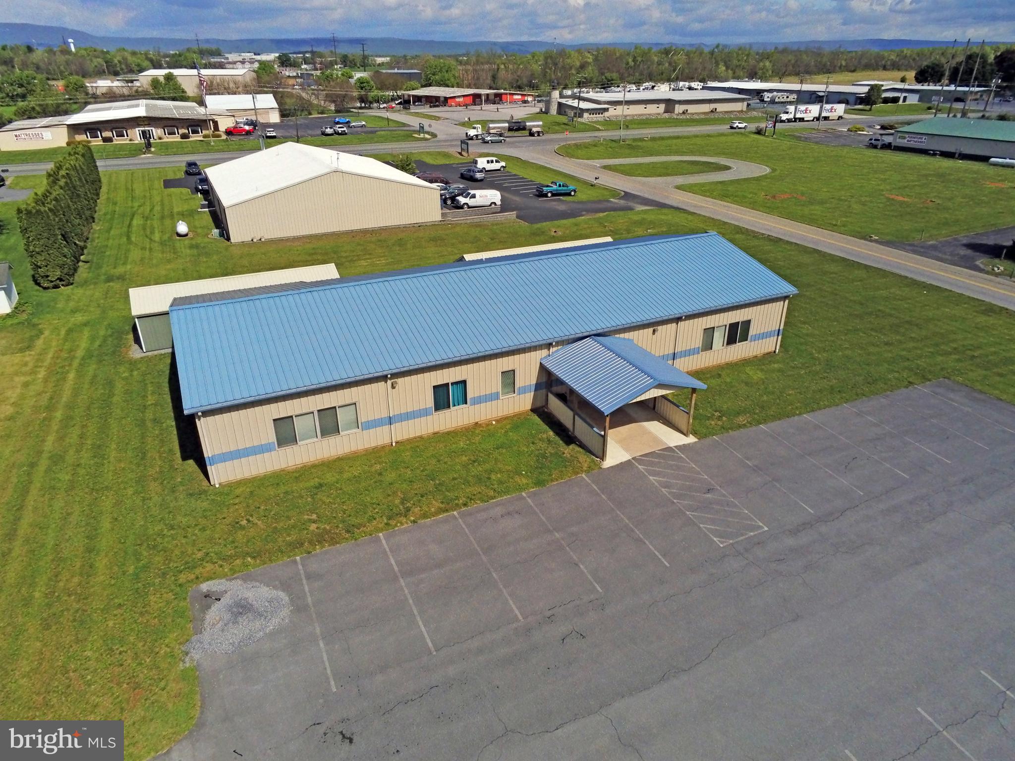 NEARLY 5,000 SQFT COMMERCIAL BUILDING- Currently Combination space.  Warehousing, shipping & office.  Built in 2008, great condition & clean!  Fully metal exterior, 3 heating & cooling zones.  Public water & sewer, two restrooms- handicap accessible.   Multiple use includes light assembly, meeting place, supply, church, dance studio, education center.  Many other uses, see below.  Step Right in with space & place for your business!  Great Highway access Rt 11 & I-81, corner lot!  Call for showing & details.
Retail, building materials and supply store, apparel, drug/specialty, grocery, farm market, antique shop, sporting goods, convenience stores, automotive.  Financial business service, credit unions, loan, real estate, insurance agencies, utility, government, professional offices, medical, dental or clinical and veterinary clinics.