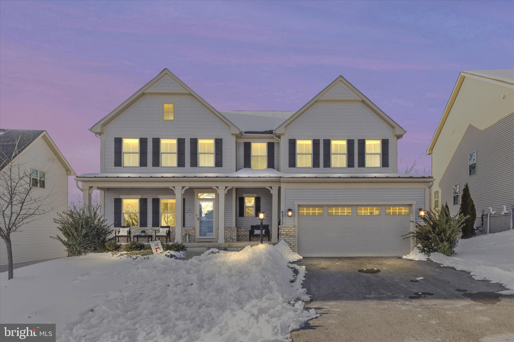 Welcome home to this stunning and aesthetically pleasing 5 bedroom Roanoke model, only 5 years young! With nods to serene selections and luxurious custom trim with upgrades balanced by nature at your back door.  The views are truly amazing.  You'll appreciate new paint throughout, seamless transitions from the indestructible LVP flooring to cozy carpeting on the sleeping and recreational LL floor.  The custom welcome center at the garage entryway is warm, cozy and is situated directly beside of a coat closet, private powder room and office space (what could potentially become a first floor bedroom).  The kitchen is just around the corner featuring an oversized  island, stunning tile backsplash, under cabinet lighting, upgraded stainless appliances to include a gas cooktop and oven with an additional wall oven, microwave and dishwasher.  A spacious well-organized pantry and eat in dining room are conveniently located within steps of newly created outside recreation space.  The covered and screened porch has an outside rated TV that conveys, recessed lighting and is fully waterproofed underneath with access to a composite deck - perfect for grilling, playing and entertaining.  Back inside, the kitchen is open to the great room/family room with cozy gas log fireplace and ample entertaining and play space.  The family room TV is yours to enjoy - yes, it stays too!  The front of the house offers a formal living room or a wonderful perfectly placed play room with sun drenched windows.  Upstairs, you'll find the entryway to the gorgeous and well appointed primary suite with tray ceiling.  Two oversized walk in closets, sitting area or coffee nook, spa like serene bathroom with private water closet.  The shower offers upgraded tile selections and dual shower heads with a long sitting bench.  Three additional bedrooms with a lovely oversized hall bath are conveniently situated.   Throughout the entire home, ceiling fans have been added to maximize your comfort and enjoyment.   The downstairs rec room space calls to you to enjoy movie time, relaxation and play time at its finest.  An oversized LL family room is book ended by another private guest suite with full bath, game room closets, organized utility room and there is even a rough in for a wet bar or kitchen.  Walk right out to the entire fenced rear yard, play area under the deck and recently and intentionally sodded zoysia grass promoting the best yard on the block.  The rear fence gate offers access to the trails for hiking and more.  This incredible neighborhood is known for its pools, lake with sandy beaches, tennis courts, pickleball, disc golf, dog parks and so much more.  Don't miss farmer's markets, summer series concerts, food trucks and fun neighborhood fun!  Enjoy planned events and unplanned gatherings - there is always so much happening in Woodridge and the Lake Linganore communities!