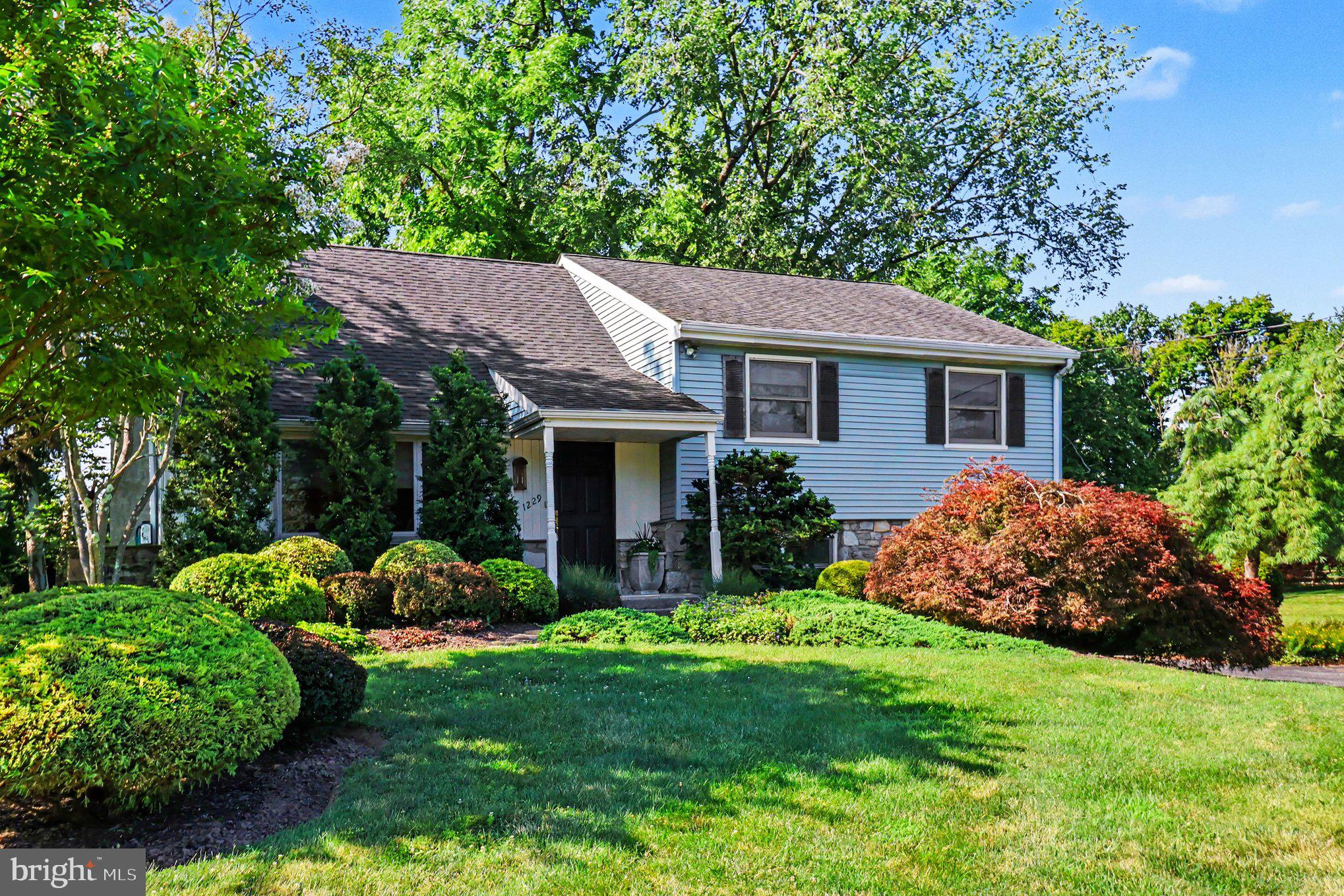 ***SHOWINGS BEGIN SATURDAY 7/25 - NO EXCEPTIONS***Welcome to 1229 Hoffman Road, where warmth, character, and exceptional care shine throughout this beautifully maintained split-level home. Tucked away in a quiet neighborhood, this inviting home immediately captures your attention with its beautiful landscaping, welcoming curb appeal, and the unmistakable feeling that it has been lovingly cared for over the years.
Step inside to a cozy living room featuring a wood-burning fireplace, recessed lighting, and a large picture window that fills the space with natural light. Just beyond, the formal dining room provides the perfect setting for gatherings and everyday meals. The adjoining eat-in kitchen offers a functional layout and features a convenient pass-through window to the sunroom, making entertaining and serving meals a breeze.
The true heart of the home is the spectacular sunroom addition. Soaring ceilings, skylights, and walls of windows create a bright, inviting space overlooking the expansive .56-acre backyard. A built-in bar adds both character and functionality, making this an ideal place to gather with family and friends. Whether you're enjoying your morning coffee, watching the seasons change, or simply taking in the peaceful surroundings, this room is sure to become your favorite. Step outside onto the dual-level deck with built-in bench seating and enjoy the privacy of the mature trees, partially fenced yard, and the abundant wildlife that calls this setting home.
The lower level offers a spacious family room with daylight windows that bring natural light into the space, creating a bright and comfortable extension of the home's living area. This level also includes a convenient half bath, laundry area, garage access, and a rear entrance giving you the ability to make this area a true mudroom.
Upstairs, you'll find three generously sized bedrooms and a full hall bath complete with tub shower. The primary suite features its own private bath with a stall shower. Continue to the third level where an additional bedroom provides exceptional flexibility as a home office, hobby room, fitness space, media room, or whatever best suits your needs.
Backing directly to the scenic Loch Alsh Reservoir, you'll enjoy easy access to fishing, walking trails, and picnic areas just beyond your backyard. Located just five minutes from the heart of downtown Ambler, you'll have convenient access to local favorites including Harry's Taproom, Forest & Main Brewing Company, and Cantina Feliz, along with boutique shopping, the historic Ambler Theater, and a vibrant calendar of community events including the Ambler Arts & Music Festival, Oktoberfest, First Fridays, and the weekly Farmers Market. Commuting is equally convenient with nearby Butler Pike, Bethlehem Pike, Route 309, the Pennsylvania Turnpike, and SEPTA Regional Rail providing easy access throughout the region. Schedule your showing today before it’s too late!