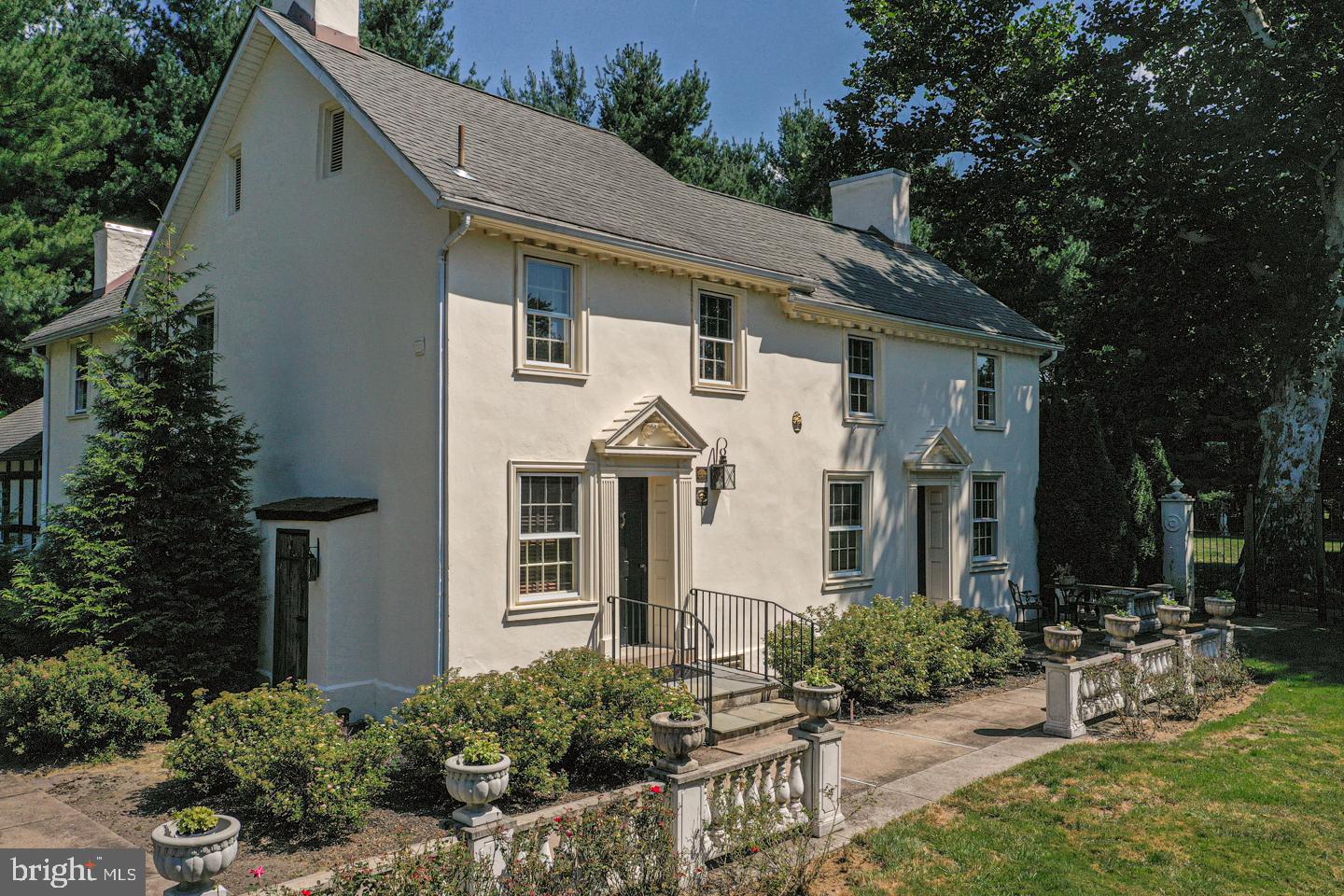 Beautifully renovated antique gem in Washington Crossing, where historic charm and thoughtful renovations come together effortlessly. This enchanting vintage home known as the Samuel Yarldey House has been thoughtfully updated while preserving the warmth, character, and craftsmanship that make period homes so special. Features that include random width pumpkin pine floors, extensive millwork including raised panel wall coverings, beamed ceilings and so much more!  The main level blends timeless architectural details with comfortable everyday living. The original section of the home built c 1720 features a large stone hearth fireplace, pumpkin pine floors, and beamed ceilings. The large Gathering Room  c 1820 showcases a large formal Dining Room and cozy lounge area with fireplace mantle after dinner conversations, a stately paneled Study that features fireplace mantle, bookshelves and hardwood floors provides great private space to conduct business or family affairs. This room also opens to large stone patio that connects to screened in porch.
The beautifully updated kitchen retains its old-world appeal while showcasing granite countertops, stainless steel appliances including induction cooktop and striking custom built cabinetry. The Breakfast Room has pine floor, paneled walls and gas fireplace, The screened in porch off of the Breakfast Room is an inviting retreat overlooking a large tone patio, lush gardens and an expansive yard.  The second floor features three bedrooms all with period detailing, and two updated full baths. The third floor offers valuable bonus space perfect for storage, a getaway space, and so much more.  Outdoor living is equally captivating. The English gardens grace the landscape with period correct out buildings for storage. A large stone carriage barn has 2 garage bays. A generous stone terrace invites al fresco dining, family gatherings, or quiet evenings under the stars, while graceful stone walkways meander thru the boxwood gardens offering a tranquil and private escape.  Ideally located minutes from the canal, a charming gourmet market, and Washington Crossing State Park makes this home truly special for the price offering. Enjoy easy access to New Jersey and close proximity to Newtown, New Hope, and Yardley—all within the sought-after Council Rock North School District.